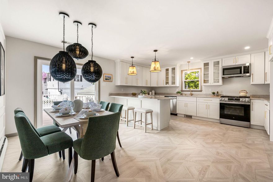 Nestled in the heart of sought-after Haverford School District, this exquisite home reinvention by Arters Collective beckons with its timeless charm and modern allure. A convenient and desirable one-floor living layout welcomes you through a charming front porch into a light-filled space boasting architectural accents such as archways, rounded walls, elegant trim and designer light oak waterproof laminate in a parquet pattern. The sun-drenched interiors reveal an open concept floor plan where every detail has been thoughtfully curated. The spacious family room offers a comfortable space to gather while the dining room is bathed in natural light from sliders leading to a large deck overlooking the yard. Culinary delights await in the kitchen adorned with shaker cabinetry with champagne hardware, quartz countertops with oversized under mount sink and stainless steel appliances. A full basement promises versatility with a recreation room featuring a cozy fireplace, finished flex space ideal for office or workout area, and a convenient powder room for guests' comfort. Retreat to the primary bedroom suite offering luxurious amenities like a walk-in ceramic tile shower, double vanity and a walk-in closet. Outside boasts more than just beauty; an oversized deck for summer barbecues and a two-car detached garage accessed via private driveway ensures ample parking. This idyllic haven with new central air is perfectly situated for easy access to Philadelphia's vibrant energy yet offers respite from city life within minutes of Main Line shopping districts and major routes like Rte 3, Professionl Photos will be uploaded on Wednesday.