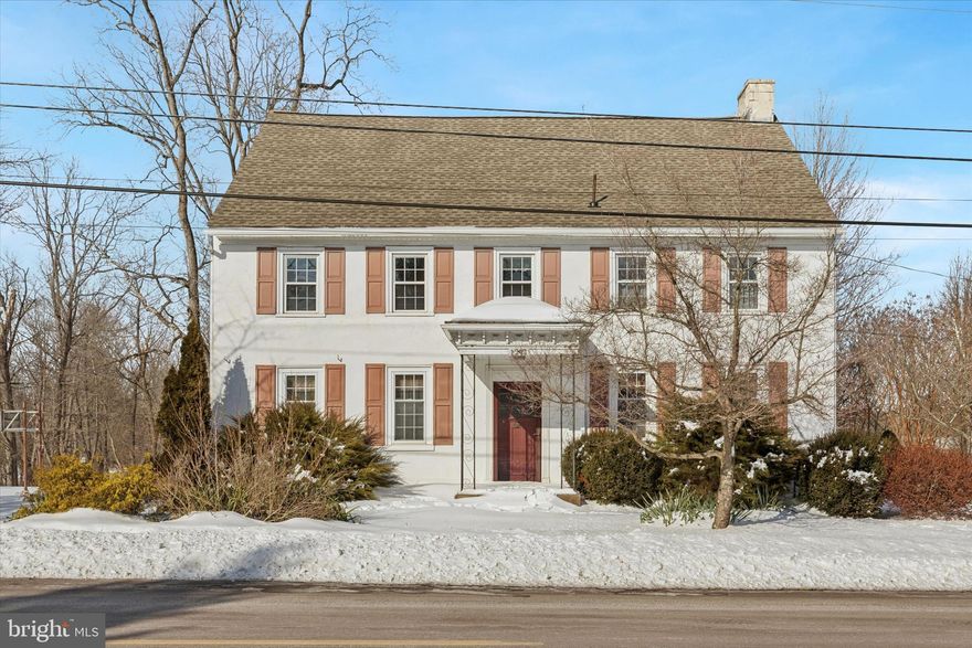 Welcome to this circa-1834 farmhouse, gracefully set on 1.6 picturesque acres in the heart of Skippack. Offering a rare blend of historic charm, enduring craftsmanship, and everyday convenience, this stately property presents an exceptional opportunity to restore and enhance a true classic. Surrounded by mature trees and open space, the setting provides both privacy and presence—yet remains just a short walk to Skippack’s vibrant shops and restaurants.The main farmhouse offers generous living space highlighted by original hardwood floors, deep window sills, and timeless architectural details. A large foyer welcomes you into a cozy family room featuring built-in shelving, wood-burning fireplace and convenient half bath. The formal dining room adjoins the expansive kitchen, which offers the potential to be reimagined as a central gathering space. Beyond the kitchen is a versatile bonus room, along with a convenient laundry/mudroom with a private entrance. The second level features five generously sized bedrooms, original flooring, two fireplaces and two full bathrooms, along with access to a full attic providing ample storage. Outside, the expansive grounds invite endless possibilities for outdoor enjoyment—from gardening and entertaining to simply enjoying the peaceful countryside atmosphere. The property includes a three-car detached garage with a separate potting room and second-floor storage, as well as an additional detached one-car garage ideal for lawn equipment and tools. New roof installed in 2020 and convenient access to public sewer. Whether you’re drawn to the home’s rich history, distinctive character, or the opportunity to make it your own, this property is more than a home—it’s a legacy awaiting its next chapter. Renovate, expand, or rebuild to create your dream estate. Acreage with original bones in this area is rarely available. Ideally located just minutes from downtown Skippack, King of Prussia, top-rated schools, major commuting routes, and an abundance of parks and scenic trail systems, this property offers the perfect balance of rural charm and suburban convenience.