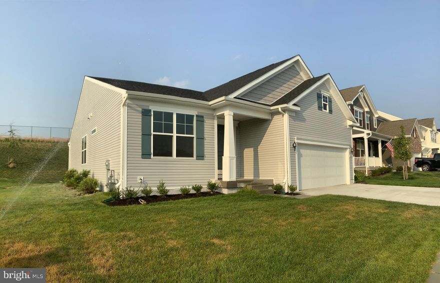 Spacious move-in ready rancher on a premium fenced lot with lots of custom upgrades! Enjoy a modern open floor plan, 9’ ceilings, high-end kitchen cabinets, granite counter tops, recess lights, stainless steel appliances. The floorplan offers an open kitchen area with a large island overlooking the dining area and spacious great room. On main level find enlarged primary bedroom with a spacious primary bath and a walk-in closet,  two more bedrooms and a full bath. Enjoy just added high quality hardwood floors throughout, modern high-end fresh paint, crown molding, open staircase with wood railings. Lower level is fully finished with huge rec room, two additional bedrooms a full bath and tons of storage. The lot is one of the largest in the community. The location is just of I-70 and in one of the best Carroll County School District.