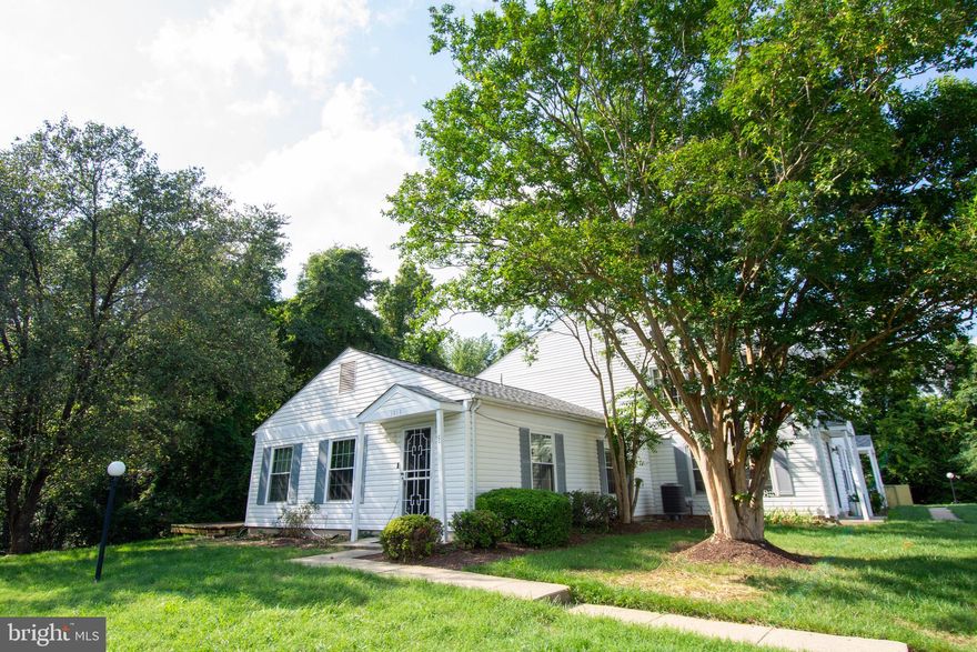 Location is EVERYTHING! Lovely 1 level, 2 Bedroom Condo with one Bath. Open  living, dining, kitchen floor plan. New appliances. Backs to woods for extra privacy. One of the few units with a freestanding deck in the back yard. TWO reserved parking spaces.