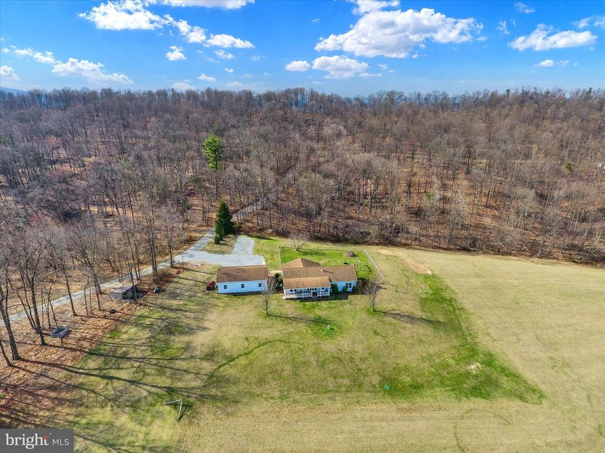 Offer Deadline Set for 3/30/26 at 7:00 PM.....This 1,902 sq ft ranch home on 1.69 acres offers country living with room to spread out and views that make a lasting impression. The home features 4 bedrooms and 2 baths, with a full Superior Walls precast concrete basement that provides excellent storage and includes potential for a 5th bedroom or additional finished living space. Geothermal heating and cooling help keep utility costs economical, while solid wood flooring throughout most of the home adds warmth and character.

Set against a large woodlot, this property offers a peaceful rural setting where deer and turkey are a familiar sight. The scenic views from the front porch are sure to wow anyone who visits, creating the perfect place to relax and take in the surroundings. The fenced backyard provides a great space for your four-legged friends to enjoy the outdoors while you unwind on the back patio.  A 28' x 40' detached 3-car garage is a valuable addition, offering plenty of room for vehicles, equipment, hobbies, or storage. Conveniently located just 20 minutes from Carlisle and 30 minutes to Harrisburg for those who want a shorter commute. With solid features, efficient utilities, and a desirable location, this property offers lasting value in a scenic rural setting.