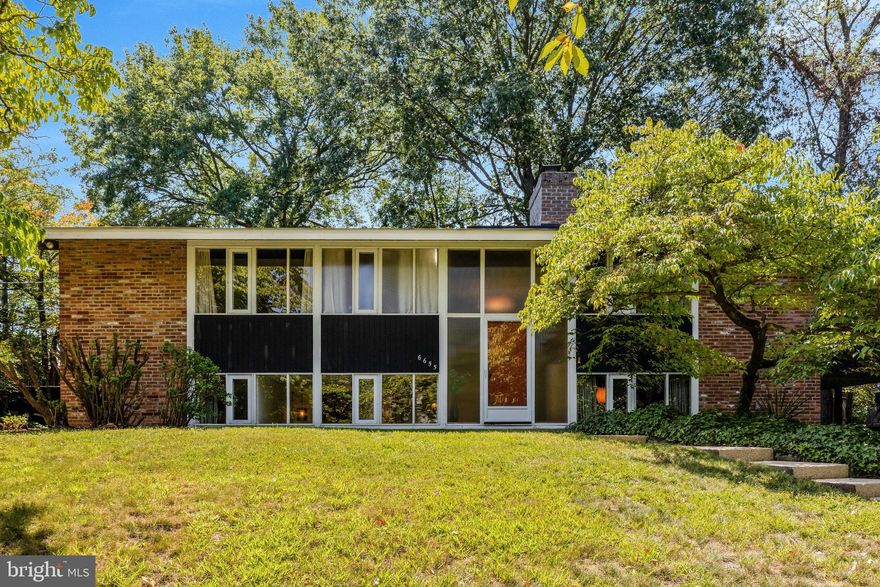 Welcome to this stunning Mid-Century Modern retreat tucked away on a quiet cul-de-sac in a lush, tree-lined neighborhood surrounded by parkland. Ideally located with convenient access to downtown Washington D.C., Tysons Corner, and both Dulles and National Airports. Commuting is a breeze  via car, Metro, or bus.
This architecturally distinctive 5-bedroom, 3-bath home showcases the timeless appeal of Mid-Century Modern design. Vaulted ceilings, expansive walls of glass, and abundant natural light create a seamless connection between indoor and outdoor living. Rich natural materials, including beautiful oak hardwood floors combined with teak furniture add warmth and character throughout the home.
Perfect for both relaxing and entertaining, this residence offers a rare combination of privacy, style, and convenience. Located in a sought-after neighborhood that feeds into highly regarded schools,. This is a rare opportunity to own a piece of classic modernism in an unbeatable location. 
 The town of Mclean has a wonderful Community Center with  hundreds of classes that anyone  can participate in  and a theater  for plays and concerts, as well as a newly built library with a  large children's playground area next door.  If you enjoy walking and don't want to be dependent on a car you will find that the location of this home is perfect for you because so many shops, coffee houses, restaurants, medical offices  are within a 5-10 minute walk from this home.