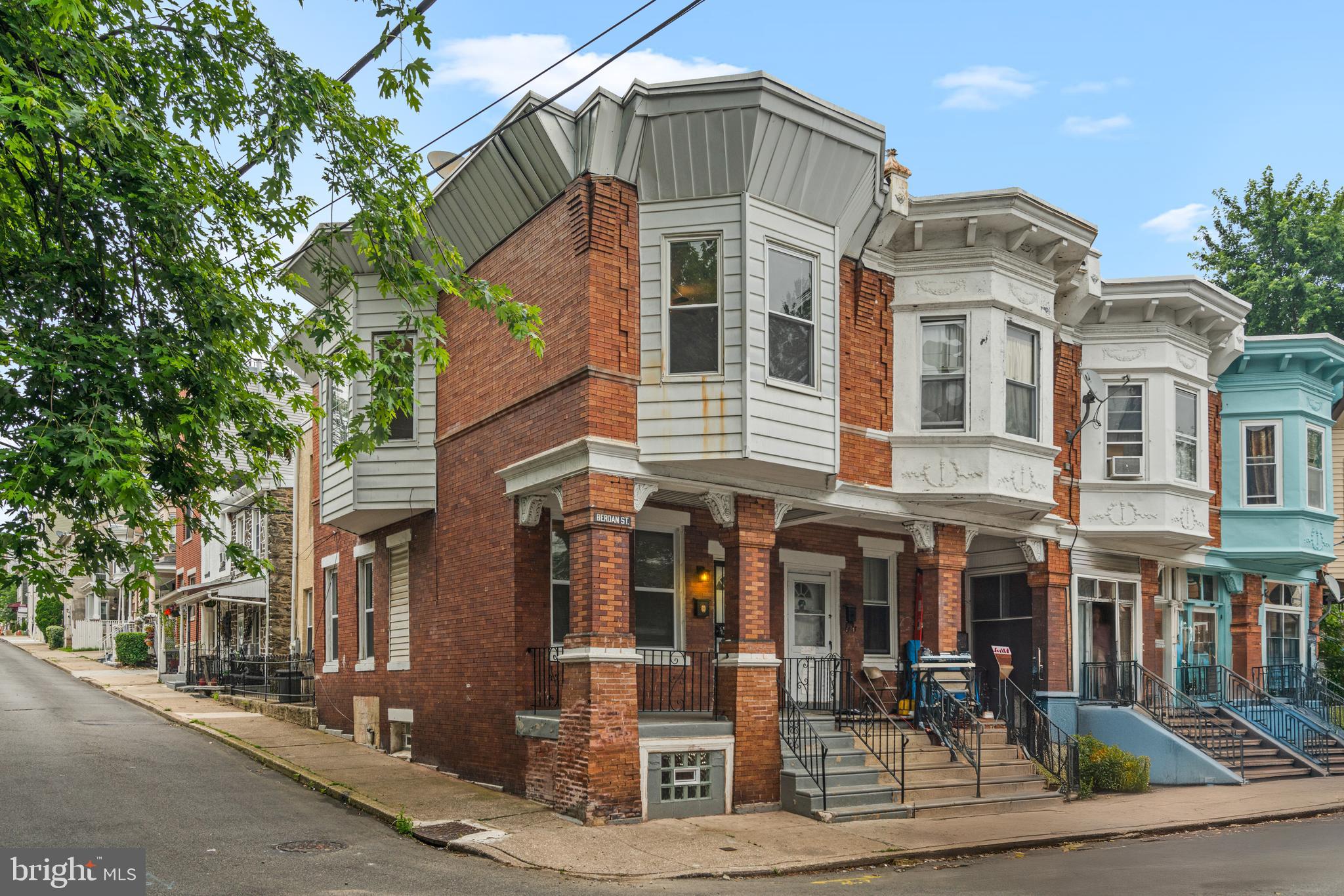 Craving peace without giving up convenience? This 4-bedroom, 1-bath end-unit red brick townhouse is calling your name. Nestled on a peaceful, tree-lined street in a dynamic, up-and-coming neighborhood, this home offers dedicated off-street parking, abundant street parking, and a warm sense of community—all just minutes from public transportation, parks, restaurants, schools, and exciting new developments. Step into the sun-drenched living room, where freshly painted walls and wide vinyl plank flooring complement oversized windows and high ceilings. The layout flows effortlessly into a cozy dining area—perfect for everyday meals or weekend get-togethers. The kitchen is a standout, featuring rich cherry cabinets, a sleek tile backsplash, and stainless steel appliances. A door leads directly to the private backyard patio—ideal for your morning coffee or impromptu BBQs with friends. Downstairs, a full basement offers exceptional flexibility with a laundry area, utility zone, storage space, and updated plumbing. The home is fully electric, but there's a gas meter in place should the future owner wish to connect. Upstairs, the primary bedroom impresses with generous closet space, joined by three additional sun-filled bedrooms that can serve as guest rooms, kids’ rooms, or home offices—whatever your lifestyle calls for. Whether you're starting out or settling down, this townhouse delivers the space, style, and setting to make every day feel like home. Schedule a tour now!