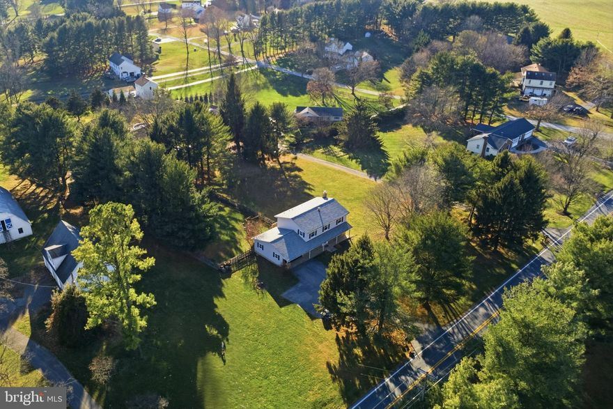 **Charming Colonial on 1.12 Acres – The Perfect Blend of Country Living and Everyday Convenience**

This inviting Colonial sits proudly on a beautiful 1.12-acre level lot, offering **the perfect blend of peaceful country living and close-to-everything convenience**. Nestled within the **highly regarded Howard County Public School System**, the home pairs a serene setting with access to all the creature comforts of modern life.

At the heart of the home is a warm **country kitchen** with generous eat-in space and **built-in cabinetry** ideal as a coffee bar, serving area, or butler’s cabinet. Recent structural enhancements have opened the kitchen, dining, and family areas, creating an easy, natural flow for everyday living and entertaining.

The cozy family room features a **wood-burning insert**, and a sliding glass door leads to the spacious deck overlooking the expansive backyard. Fresh professional paint and brand-new flooring add a crisp, move-in-ready feel throughout.

Upstairs, you'll find **four comfortable bedrooms** and **two full baths**. A **half bath** and newly relocated **main-level laundry** add wonderful functionality on the first floor.

The **oversized, insulated two-car garage** offers excellent storage and workspace potential. The lower level includes a **brand-new full bath**, a sliding walkout to the backyard, and a wide-open  area that presents endless possibilities. A versatile bonus room makes an ideal office, guest room, or hobby space.

With numerous newer improvements—roofing, siding, gutters, windows, flooring, kitchen updates, plumbing enhancements, mechanical upgrades, and more—this home offers comfort, efficiency, and long-term peace of mind.

A long, wide driveway provides ample parking, including potential space for recreational vehicles. Routes **70, 94, and 27** are moments away, making commuting and amenities easily accessible.

This beautifully maintained Colonial blends charm, space, and modern updates with the relaxed feeling of country living—without giving up the conveniences you love.