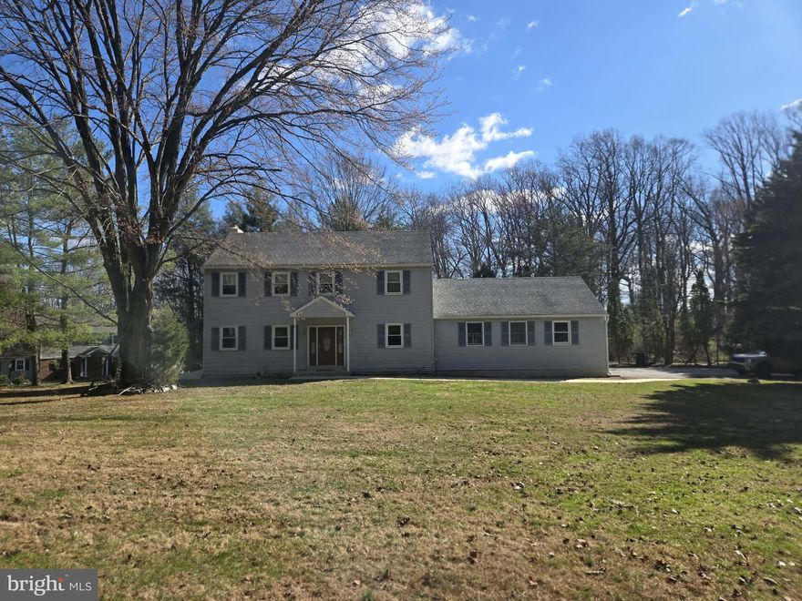 Professional photos & floorplan will be added on Friday! Welcome to 1652 Garnet Mine Road — a spacious, updated home set on nearly two private acres. Tucked far back from the road and surrounded by mature trees, this property offers the perfect blend of privacy, space, and convenience. Inside, you’ll find a warm, move-in ready interior with sun-filled living spaces, neutral tones, and thoughtful updates throughout. The main level features formal living and dining rooms, along with an open kitchen and family room anchored by a wood-burning fireplace. Fresh paint and brand new luxury vinyl plank flooring run throughout, along with a convenient powder room. Upstairs, the primary suite offers vaulted ceilings, a walk-in closet, and an updated bathroom with a brand new double-sink vanity, new tile flooring, and a walk-in shower. Three additional well-sized bedrooms, an updated hall bath, and a second-floor laundry closet add both comfort and convenience. The fully finished walkout basement provides incredible flexibility with additional living space, two bonus rooms, storage, and a roughed-in area for a future bathroom. There is an oversized two-car garage with full walk-up loft/attic storage space. Step outside to the maintenance-free Trex deck overlooking the backyard. The expansive yard offers endless possibilities—from summer barbecues to play space, gardening, or simply unwinding in your own private outdoor oasis. Located in the award-winning Garnet Valley School District and just minutes from shopping, dining, and major routes, this home truly offers the best of both privacy and accessibility. If you’ve been searching for space, setting, and a true sense of home—this is it.