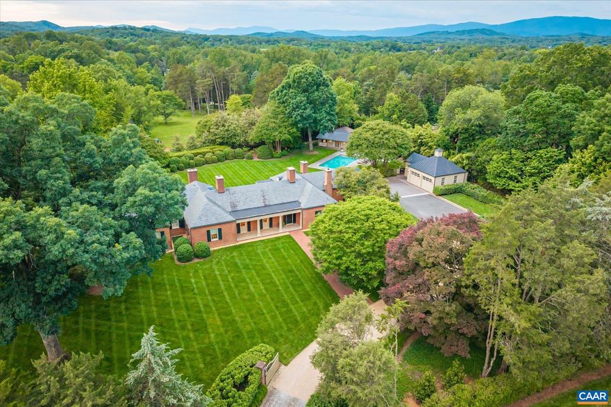 Renovated and well appointed, this exceptional Farmington estate offers main-level living, generous proportions, and refined details throughout. A chef?s kitchen anchors the four-bedroom home, complemented by six fireplaces that add character and warmth. The residence features a serene primary suite, a home office, a finished basement, and updated baths throughout. Outdoors, a private oasis awaits with saltwater pool, bluestone terraces, landscape lighting, and outdoor shower. A detached two-car garage includes a dedicated golf cart bay. The separate 1,335 sq ft guest cottage provides two bedrooms, two full bathrooms, a laundry room, kitchenette, and a gracious great room with fireplace, perfect for guests or extended stays. Beautifully landscaped and filled with natural light, this turn-key retreat offers timeless elegance, modern comfort, and unmatched proximity to nationally ranked Farmington Country Club.,Marble Counter,White Cabinets,Wood Cabinets,Fireplace in Family Room,Fireplace in Home Office,Fireplace in Kitchen,Fireplace in Living Room,Fireplace in Master Bedroom,Fireplace in Rec Room