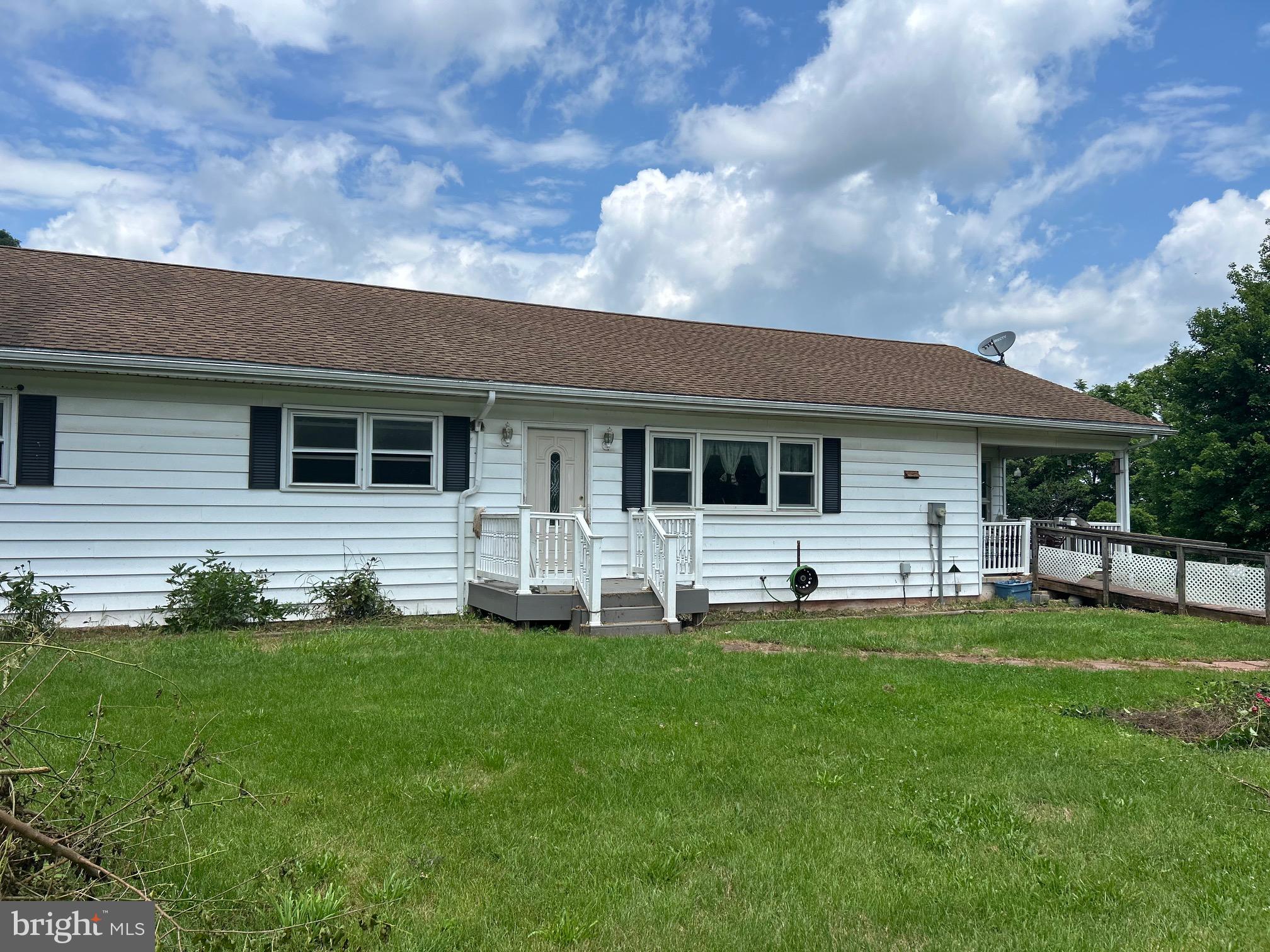 Great Location for this Rancher with 3 Bedrooms 2 Baths and Fantastic Floor Plan. Home is a work in progress as seller is making improvements. The family room/bonus room has hardwood floors and a wood burning insert. The living room has hardwood floors and spacious enough to meet all your needs. Kitchen has all the cabinetry and counter space you will want and a very large island with electric. 3 nicely sized bedrooms compete the main level. The walk out basement has the potential to add a formidable amount of additional living space. The Real Estate includes 2 separate lots with 2 wells and a great setting. Do a drive by while you are awaiting the listing to go active.