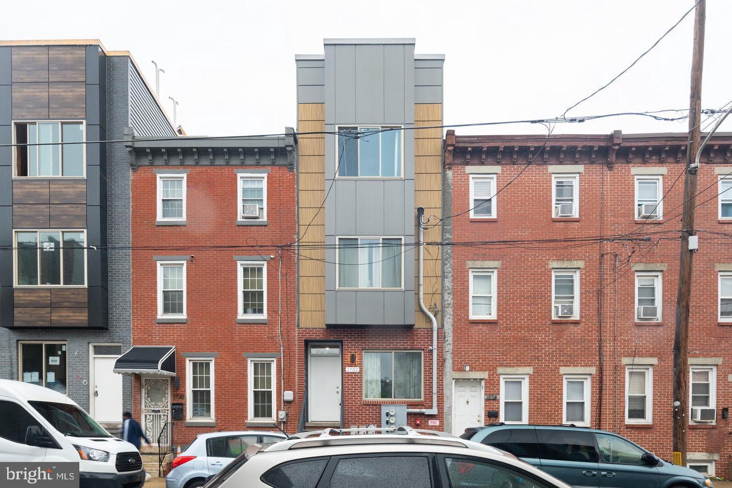Welcome to 1752 N Marshall St, a modern newer construction triplex ideally located in the heart of Olde Kensington. This fully leased, turn-key investment features three bright and stylish units, each with in-unit washer/dryers, hardwood floors, recessed lighting, and smart home features like built-in speakers, alarm systems, and security surveillance.
Unit 1 is a spacious bi-level 3 bed, 2 bath layout. The lower level offers two large bedrooms, a full bath, and laundry, while the main floor includes a modern open-concept kitchen, living and dining area, an additional bedroom, and a second full bath. Units 2 and 3 are thoughtfully designed 2 bed, 1 bath apartments with contemporary kitchens featuring shaker cabinets, granite countertops, stainless steel appliances, tile backsplashes, and plenty of natural light. Unit 3 also boasts a private roof deck with beautiful city views—perfect for relaxing or entertaining.
Located on a quiet block steps from top neighborhood spots like Sutton’s, Luna Café, and Old Kensington Beer Garden, and just minutes from Fishtown, Northern Liberties, and Temple University, this is a prime opportunity for investors or owner-occupants seeking a high-performing property in a thriving community.