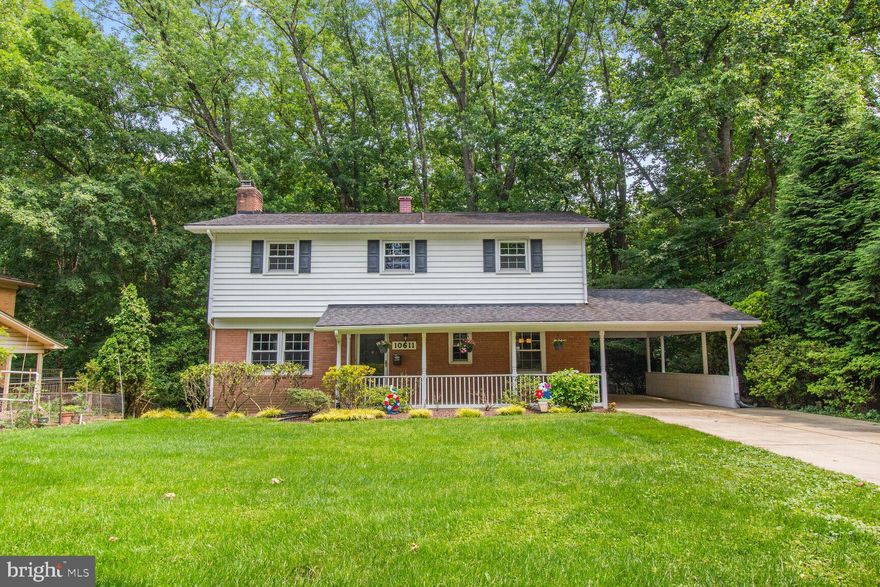 Charming single-family home in Silver Spring with 4 bedrooms, 2 full and 2 half baths, this home blend comfort and flexibility enter into a bright living room and a cozy fireplace and backyard views. This house offers over 2,461 square feet of comfortable living. Well keep hardwood floors goes throughout the house, plenty of natural light. The house features a cozy wood fireplace, a fully finish walk out basement with an additional room that can be converted to movie or a bedroom. A spacious front yard with covered front patio and a fenced backyard. The back patio faces a wooded area providing a beautiful view of wild life all year-round and you can hear the stream of a river runs through the property making this house even more attractive. Convenient driveway parking and covered carport, plus the house is ideally located near the 495 Beltway, and Colesville making commuting and travel throughout the region quick and convenient. The peaceful neighborhood is within minutes to shopping, restaurants, Trader Joe's, Starbucks, and other conveniences stores. Don’t miss this opportunity to own a move-in ready home. Schedule a showing today!