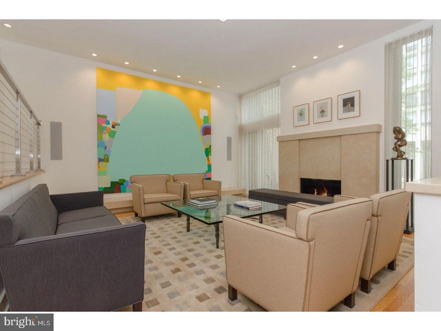 This beautifully renovated three-bedroom, three-bathroom Society Hill masterpiece offers loft-like proportions and endless sunlight in one of Downtown's most sought-after neighborhoods. This 2752-square-foot retreat benefits from 10-foot-tall ceilings, floor-to-ceiling windows and a series of smart renovations have maximized the pervasive sense of space and light. The pristine kitchen has been opened up and beautifully outfitted with gleaming white lacquer cabinetry and top-of-the-line appliances. In the sprawling open-plan great room, a neutral color palette and bright southern light create a serene environment where open sky views take center stage. Wood flooring runs throughout, and handsome built-ins and a gas fireplace underscore the room's fitness for gracious entertaining and lounging. Three complete bedroom suites offer luxurious sleeping accommodations. The quiet master suite benefits from lovely courtyard views and includes two custom closets, including a walk-in, and a serene limestone master bathroom  with separate walk-in shower and dual-sink vanity. A second large bedroom includes a spacious closet and well-appointed adjacent bathroom, and the home's 3rd bedroom has been converted  to a den with convenient shared access to the full guest bathroom. If impressively-scaled entertaining is a goal, there's a large open lower level featuring  a full bath , the highest-end wood built-in finishes, radiant heat flooring, a home management area and floor to ceiling glass sliders out to a landscaped patio.  Your own deeded parking space is just outside your patio door. This high-tech home offers abundant features for effortless living: There's is a laundry room with a washer-dryer; all curtains are operated electronically; Lutron lighting runs throughout; and full pre-wired system audio-video integration with speakers and extensive WiFi coverage has been installed. Surrounded by Head House Square and Little Italy, world-famous shopping, dining, nightlife and cultural venues unfold in literally every direction, and the spectacular River Walk is just minutes away. This highly accessible location is surrounded by abundant nearby transportation options.