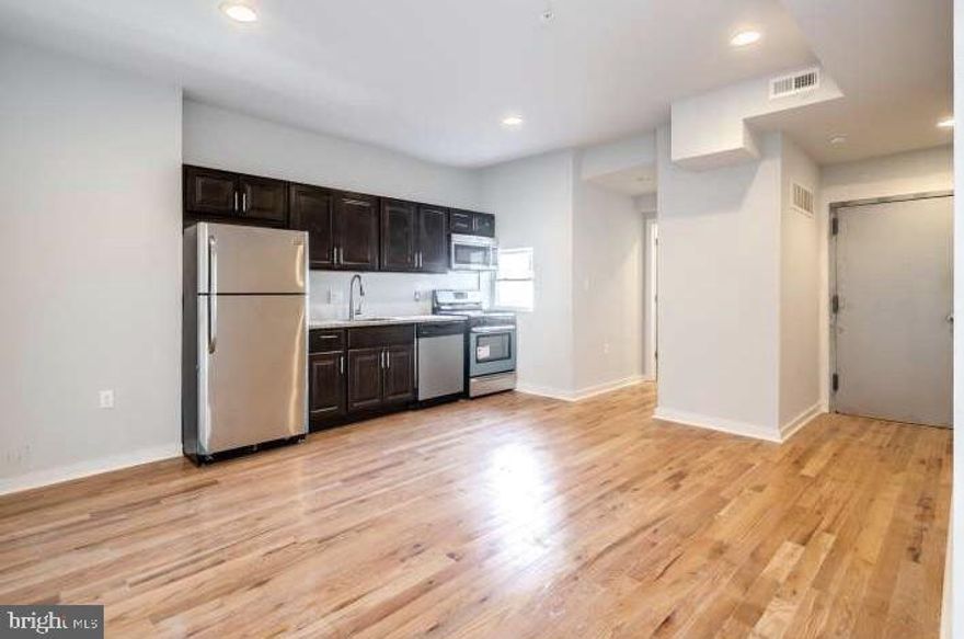 Located in the Newbold/Melrose section of South Philadelphia on Broad/Wolf Street at 2221 S. Broad Street, this stately limestone building was gut rehabbed with top-of-the-line renovations. This large, gorgeous 1BR/2BA, multi-level Penthouse apartment features high ceilings, hardwood floors throughout, lots of natural sunlight, granite countertops, plenty of closet space, and stainless steel appliances including a dishwasher. The large, tiled bathrooms are sleek and modern. There is additional storage space in the basement where you will also find two sets of coin-operated washers and dryers. Living on the edge of both Passyunk Square and Point Breeze, you'll have easy access to all of the surrounding shops, bars, and restaurants; not to mention the Snyder subway stop (1 block away) which will have you to Center City in 5 minutes! Pets allowed. Central a/c and shared laundry on premises. Specials: Just first and security to move in (upon credit approval)!