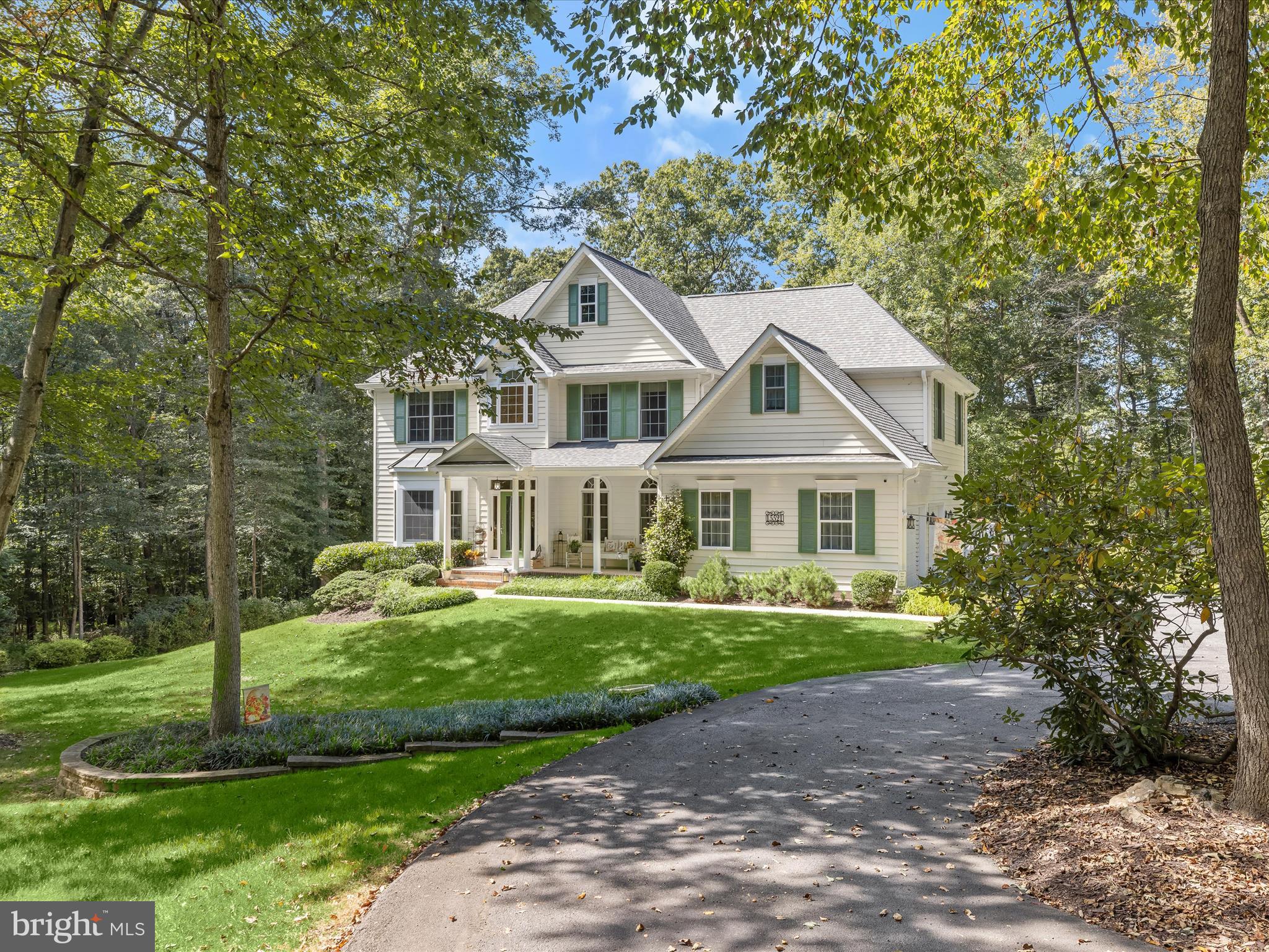 Welcome to 15521 Foxpaw NW Trail, a spectacular Colonial nestled in the prestigious Foxport community. This residence blends timeless elegance with modern updates, featuring a brand-new roof, renovated kitchen and bathrooms, updated HVAC, and more. Inside, gleaming hardwood floors, classic moldings, and sun-filled interiors create an inviting ambiance. The grand two-story foyer is flanked by formal living and dining rooms, setting the tone for refined gatherings. At the heart of the home, the chef’s kitchen delights with granite countertops, decorative tile backsplash, an expansive center island with breakfast bar, sleek appliances, and a butler’s pantry for seamless entertaining. Just beyond, a stunning screened porch with soaring cathedral ceilings offers the perfect spot to relax while overlooking the serene backyard. The dramatic two-story family room, anchored by a cozy fireplace and a wall of windows, is ideal for both intimate moments and large gatherings. Additional main-level highlights include a private office with French doors, a powder room, laundry room, and direct garage access. Upstairs, the luxurious primary suite impresses with a tray ceiling, generous walk-in closet, and a spa-inspired en-suite bath featuring a soaking tub, glass-enclosed shower, and dual vanities. Three additional bedrooms and a beautifully updated full bath complete the upper level. The finished lower level offers incredible versatility with a sprawling game room with additional fireplace, bonus space for a home office or guest room, a full bath, and ample storage. Outside, enjoy an outdoor oasis set on a 3.22 acre lot with a deck, patio, and secure storage, all surrounded by thoughtfully landscaped grounds perfect for outdoor living and entertaining.