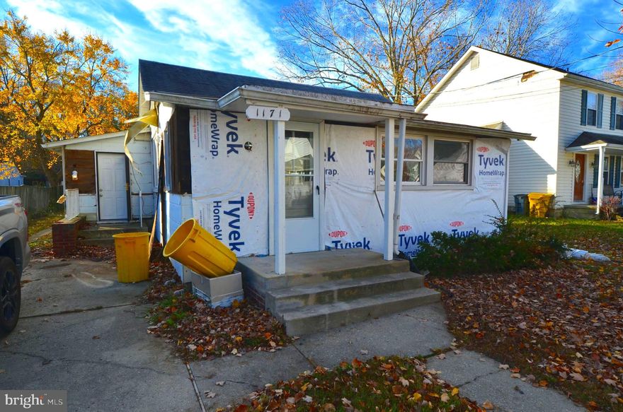 Investor alert. Cash only. Will not pass any financing due to the old siding was removed and new siding needs to be installed. Small cottage with central a/c.,  full size washer & dryer, enclosed front porch for additional living space. Must show proof of funds. Sold "as is" including any materials left on site. Walk to community pier, beach, marina, boat ramp & playground.