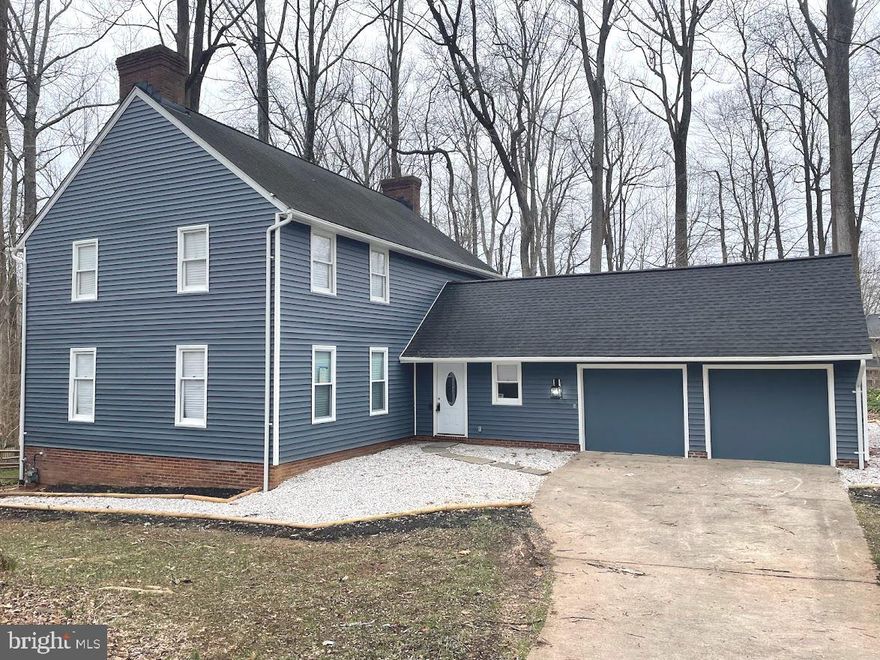 Sensational, fully renovated home on a quiet cul-de-sac.  This spacious home features 6 bedrooms, 3.5 baths, with 3600 sf of finished space.   Hardwood floors cover the top two levels, bright living room with wood-burning fireplace leads to a remarkable kitchen with enormous island, quartz countertops, chic tile backsplash, new stainless steel appliances, and an eat-in dining area with new light fixture.  Off the kitchen is a sprawling family with second wood-burning fireplace, convenient main level guest room with a separate entrance can be used as a home office, a laundry room with utility sink and shelving, and a powder room.  The upper level boasts a master suite with walk-in closet and private full bathroom with separate vanity/dressing area and a tile shower.  Three more generously sized bedrooms and a large hall bathroom complete the top level.  The fully finished walkout lower level features new low maintenance flooring, two large recreation/bonus rooms, another bedroom with attached full bathroom with stylish tile shower, perfect for an in-law suite.  Home is situated on a magnificent, serene .37 acre lot with beautiful landscaping and mature trees.  Conveniently located close to public transportation, major routes, minutes to Columbia Mall, hospital, near parks and trails, this home perfectly blends relaxed living with convenient urban life.