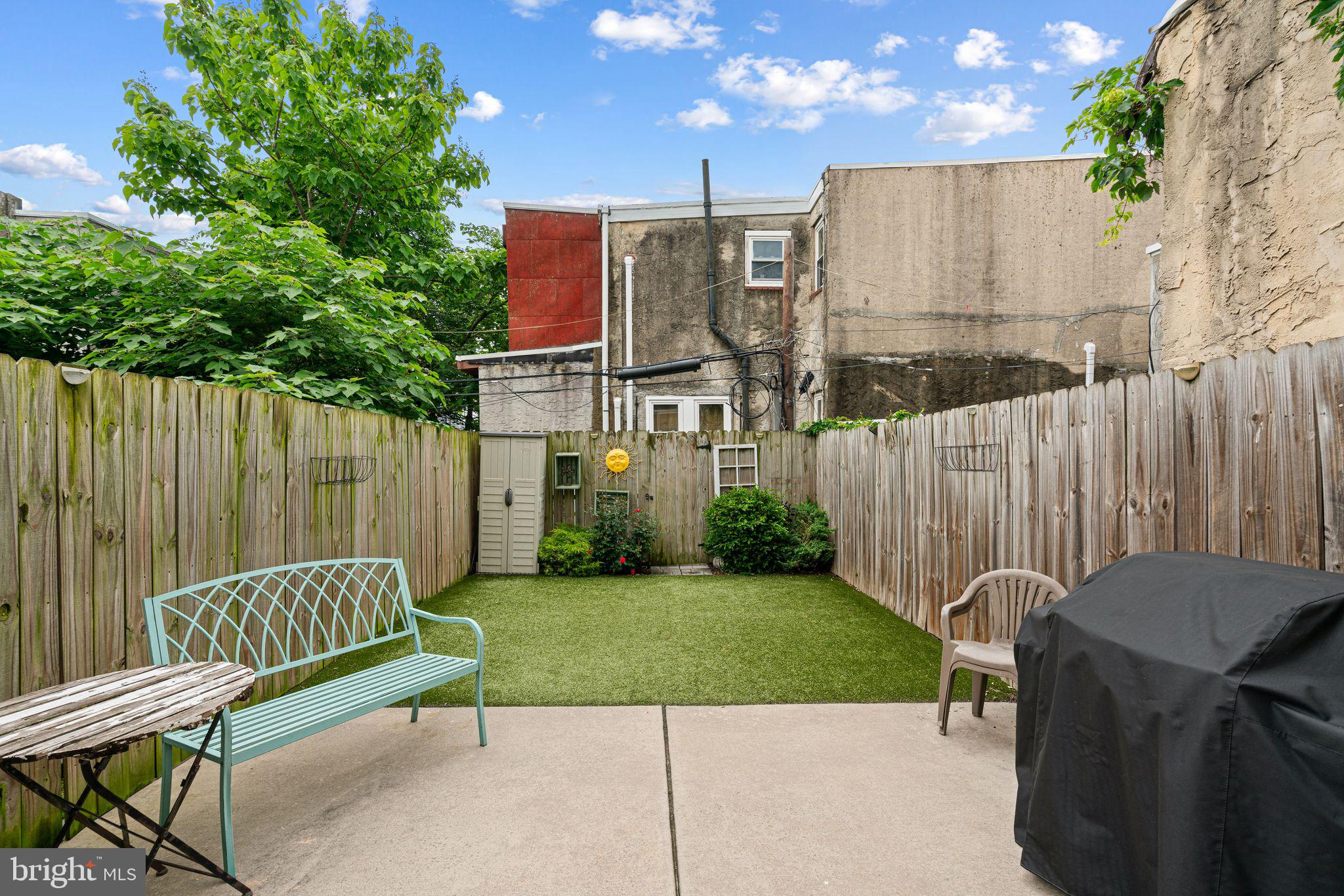 This one checks all the boxes. Just a 15 minute walk from Rittenhouse Square, this modern, move-in-ready home blends city living with great indoor-outdoor space. Inside, you’ll find an open layout with hardwood floors, a sleek kitchen with quartz counters and stainless steel appliances, and spacious bedrooms—including a primary suite with its own bath and great closet space.
Head upstairs and you’ll find a wet bar and a convenient half bath right next to the roof deck—perfect setup for entertaining or relaxing with skyline views. Right off the kitchen, the backyard is fully finished with low-maintenance turf, giving you a clean, green space to hang out or let pets run around. Just inside is a second conveniently located half bath, making this home an entertainers dream.
Your fifth bathroom is located in the fully finished basement, complete with a stand up shower. With quick access to public transit, shops, parks, and restaurants this home makes city living easy and enjoyable.