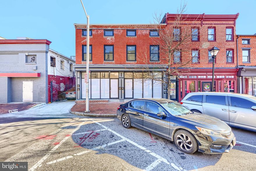 Discover a prime investment opportunity in the heart of the bustling Hollins Market business district. This updated commercial property, built in 1900, boasts a solid brick and frame construction, ensuring durability and character. The 1st floor houses two commercial units and one studio apartment. While the 2nd and 3rd floors are apartment units with 2 bedrooms (2nd floor) and one bedroom (3rd floor). The building is completely renovated with sprinkler systems, separately metered and has versatile flooring options, including vinyl, ceramic tile, and concrete, allowing for easy customization to suit your business needs. The property is located in a corner lot, which offers excellent visibility and accessibility, making it an ideal location for a variety of business ventures. The surrounding area is vibrant, with a mix of shops, restaurants, and local attractions, creating a dynamic environment that draws foot traffic and potential customers. Enjoy the stunning views of the city and street, enhancing the appeal of your business to passersby. Investing in this location not only offers immediate business potential but also positions you for long-term growth in a thriving district. The combination of a historic building and a strategic position creates a unique opportunity for savvy investors looking to capitalize on the area's ongoing development and revitalization. Seize the chance to make your mark in this vibrant community, where the potential for returns is as bright as the city views.