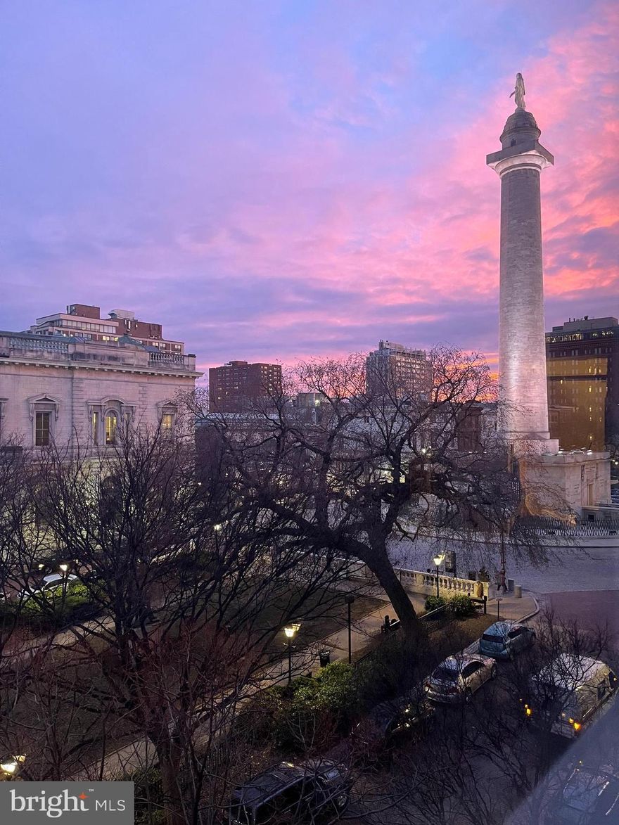 Welcome to the Carroll House, an architectural gem nestled in the heart of historic Mount Vernon. This one-bedroom, one-bathroom condo offers 798 square feet of charm, blending timeless elegance with modern comfort. As you step inside, you will be captivated by the birds eye view captured on the third level of the mansion, which creates a sense of grandeur from each of the rooms. Large, well-placed windows allow natural light to flood the space, highlighting the unique architectural details and classic molding throughout. The living room is particularly inviting, with ample room to relax or entertain, all while taking in an uninterrupted view of the nearby Washington Monument. Enjoy, original of the mansion, gleaming oak flooring set in a herringbone pattern with a cozy fireplace to set an alluring ambiance. The bedroom is a serene retreat with plenty of closet space, and the bathroom exudes a sophisticated charm, combining classic style with modern amenities. The kitchen is both functional and stylish, providing everything you need for preparing meals at home with a breathtaking view to dine beside. The condo has a large shared area for gardening and a patio for entertaining guests. Located in a former mansion of the descendants of Charles Carroll who was one of the signers of the Declaration of Independence, this condo is the perfect balance of history and contemporary convenience. Surrounded by tree-lined streets, historic buildings, and charming shops, you'll feel overwhelmed with a zest to explore everyday. Experience the vibrancy of Mount Vernon while enjoying the comfort and elegance of your unique home in this landmark residence.  You will never find another one quite like this one!