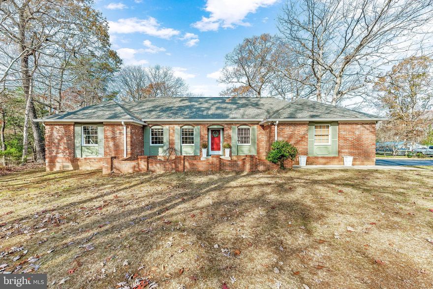 Custom CHARM! This 1740 Sqft ALL BRICK 4 Bedroom 2 Bathroom Rambler w/ a 2 Car Attached Garage & a Partially Finished Basement is FULL of CHARM & Character! From the Street, the FLAT 2/3 of an Acre Corner Lot is the first thing you notice! The large, paved driveway leads you to sidewalks that flank the driveway and lead you to either the front or rear entrances. Around front a unique patio area is surrounded by a decorative brick barrier which also encloses a small courtyard/garden area. Just inside you enter into the warm & inviting great room which has vaulted ceilings, custom built-ins, a brick fireplace, crown molding, & gorgeous pine flooring. To the right is the bright and airy kitchen/breakfast area. The breakfast area has ample table space & a large double window overlooking the back yard. The kitchen has custom white/glass cabinetry, butcher block countertops, gourmet stainless steel appliances, & recessed lighting. Located just off the great room is a screened porch that leads to two separate patio areas & the fenced in back yard. To the left of the family room is the main floor hallway leading to the hall bathroom, a primary bedroom w/ a full bathroom, & 3 additional bedrooms. The primary bedroom is large enough to fit a king bed. The large primary bathroom is equipped with a ceramic tile floor & shower as well as a custom vanity & mirror. A walk-in closet with custom built-ins completes the primary suite. The basement begins with a large, finished laundry room and that spills into an L-shaped unfinished area perfect for storage. Outside the back yard is truly one of a kind w/ plenty of fenced in area for your pets, a built-in chicken coop, & a shed that triples as a greenhouse, potting, and/or storage shed! This home is a must see!