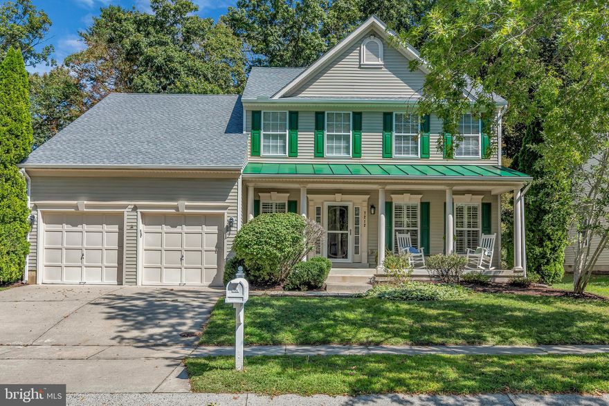 The Woods at Stoney Ridge -  Come and visit this beautiful, spacious 4  bedroom home with an open floor plan situated on an almost 1/2 acre lot.  Walk out to a private patio to relax or entertain or play children and pets in the in the rear fenced yard which backs to woods and open space. This lovely Colonial home has a large welcoming front porch offering abundant space to enjoy the newly landscaped yard.  Recent updates include, a new roof, HVAC system, carpet in all upstairs bedrooms and hallway.    
Hardwood flooring in the fabulous new Gourmet kitchen features white cabinetry, a beautiful backsplash, stainless steel appliances and a 5 burner gas stove.  The eat-in breakfast area has built in bench seating with storage.  The upstairs offers a spacious primary retreat with a walk-in closet and ensuite bath. There are 3 additional bedrooms and a full bathroom.
Other features include hardwoods floors throughout the main floor, an office/study with nature light streaming through the large picture window, crown molding and plantation shutters in the dining room and a gas fireplace with high ceilings in the family room.  The 2 car garage has an area for a workshop or extra storage, and there is an underground irrigation system in both the front and back yard.
