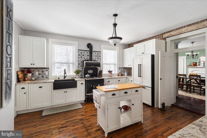 HUGE PRICE ADJUSTMENT!  You just have to see this Petersburg gem - located right in the heart of town and only minutes to hiking, rivers, caverns, fishing, shops, and so much more.   Whether you are looking for a weekend get-away retreat, full time residence, bed and breakfast opportunity, or quaint shop  or tea room - 101 Virginia offers endless possibilities!   This beautifully updated home is overflowing with cozy charm that will make you feel like have stepped into a Hallmark movie.  Originally built in the 1800's, and then added onto in 1920, and now updated for modern living, this home is a showstopper!  Are you looking for a wonderful get-away home for vacations?  This home is the perfect with its location in the middle of town and close proximity to hiking, shopping, and exploring.  Zoned for commercial, it would also make a wonderful Bed and Breakfast or even a gift shop.  The sellers have lovingly updated the home so that you will have all of the modern comforts .   Oh, and THAT Kitchen!  Prepare to fall in love!  Yes, there is a dishwasher and modern refrigerator all tastefully out of sight behind decorative doors.... and YES, that is a fully working stove and oven!   You will always have plenty of room for family or guests with the 4 large bedrooms... 1 Primary bedroom suite on the main level, and 3 additional on the upper level.  Be sure to check out the claw foot tub upstairs too.  There are too many unique features to this historic beauty that it just begs to be seen in person.  Be sure to view the 3D home tour and Video Tour. Then call your agent or the listing agent to learn more and to experience this home in person!