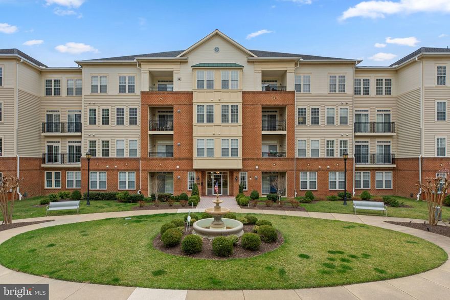 Charming condominium in the sought-after 55+ community of Kensington Gardens at Ellicott Hills offering 2,280 square feet of thoughtfully designed single-level living, featuring 3 bedrooms and 2 full baths. Step inside to a bright and inviting interior, enhanced by abundant natural light from its desirable corner location, which provides windows on two sides. The unit’s position also offers a pleasant mix of views, including the landscaped courtyard. Conveniently situated on the second floor, the condo is just steps from the staircase leading directly to the rear parking spaces, ensuring easy access. 

The spacious living room features elegant wainscoting, while the formal dining room is adorned with a chair rail and a stunning chandelier. A versatile bonus room, accessed through sliding doors, is perfect for a quiet home office or cozy den. The eat-in kitchen is both stylish and functional, featuring stainless steel appliances [dishwasher updated in 2024], a center island, ample cabinetry and counter space, and a charming breakfast nook for casual dining. This home offers three well-appointed bedrooms and two full baths, including a massive primary suite with two closets—one a walk-in—and a private ensuite bath showcasing dual sinks, a large corner soaking tub, and a separate shower with a built-in bench. The additional bedrooms are comfortably carpeted, and one offers dual-entry access to the hall bath. A dedicated in-unit laundry room adds convenience [washer and dryer updated in 2022]. 

Enjoy an array of community amenities, including beautifully landscaped grounds, a community center, a pool, and 1 assigned parking space. Kensington Gardens is ideally located near Ellicott City’s top shopping, dining, and conveniences. The property also includes two storage units and an inside garage for added convenience