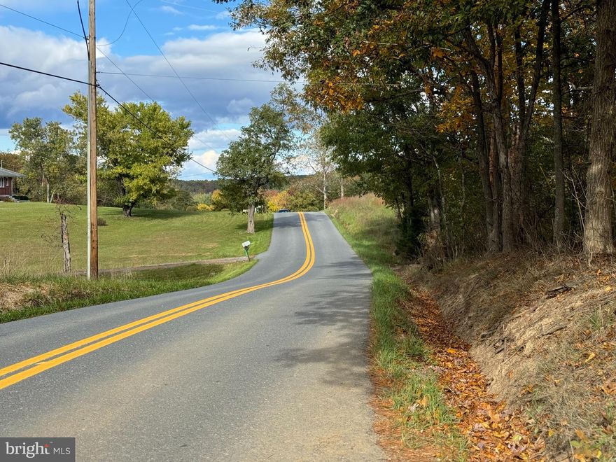 This beautiful 4.74-acre parcel offers the perfect setting for your dream home.  Convenient to Winchester VA or Berkeley Springs WV. Nestled in the serene countryside,  this property offers privacy while being just a short distance from the charming and historic town of Berkeley Springs, WV. Renowned for its healing thermal waters, unique spas, and picturesque mountain views, Berkeley Springs offers a relaxing escape from the hustle and bustle. Outdoor enthusiasts will love the proximity to Cacapon State Park, where you can enjoy hiking, golfing, fishing, and swimming in the scenic lake. Explore the local shops and dine at cozy restaurants. The property is conveniently located just 1 mile from the Virginia state line, offering easy access to neighboring attractions. Whether you're seeking a permanent residence or a weekend getaway, this location provides the perfect balance of peaceful rural living with nearby amenities and recreational opportunities. Don’t miss the chance to make this stunning spot your own!
