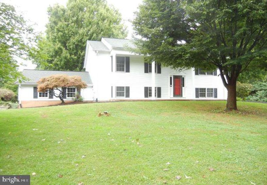 Beautiful 5 bedroom 2.5 bath home with great updates! Completely repainted, brand new carpet, refinished  solid oak floors, and new LED light fixtures throughout. Home sits on over 1 acre of land & in a quiet neighborhood. Main level has 3 bed 1.5 bath, large kitchen, formal living room, and sunroom. Lower level with huge family room, 2 bedrooms, and 1 bath. Large attached 2 car garage. Shows well. Is a MUST SEE!