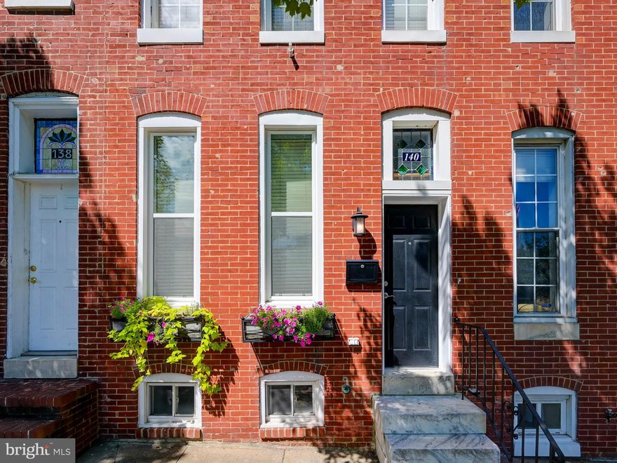 This Butchers Hill home is on the market after 17 years of having been lovingly cared for and updated.  As you enter, you are greeted by the high ceilings, custom woodwork, gas fireplace with granite facade, and Brazilian cherry floors.  The open floor plan invites you into a spacious living room and dining room area.  From there, the natural light from the tall windows leads you into a bright and spacious kitchen which includes recently updated appliances, gracious countertop and cabinetry space, as well as a large countertop peninsula -perfect for entertaining!  Also on the main level is a convenient first floor full bathroom, one of 4 bathrooms in the home complete with radiant flooring. Out back you escape to a gorgeous back yard complete with flagstone patio, brick seat walls, and a large garden planter, ideal for your new city garden!  Upstairs you will find 2 large bedrooms and fabulous custom closets.  The primary bedroom has an en suite bath with Kohler fixtures, and just down the hall is a stunning new full bath.  Downstairs is fully finished with a large family room/recreation space with built-in custom cabinetry, newly renovated half bath, and a separate additional room/office space and plenty of storage.  At nearly 2,000 finished square feet, this home is listed at an amazing price!  Your new home awaits you on Collington Avenue, a short walk to JHH, Kennedy Krieger, Patterson Park and all the surrounding locales like La Barrita, Ministry of Brewing, Charmed Kitchen, Water for Chocolate, and soon-to-be Marta Modern Italian Kitchen and Parlour.  Come be a part of the wonderful Butchers Hill Community!