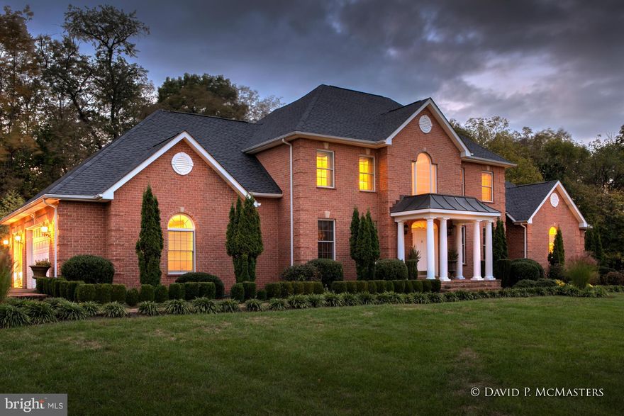 Gorgeous,spacious + gracious all brick CUSTOM colonial great estab'd community, Millpoint, 2 acres, lot backs to woods.Every possible amenity. First floor huge master suite. Big chandeliers, moldings, fireplaces. Brazilian cherry floors, 3 fireplaces, library w/floor to ceiling book cases.Granite gourmet kitchen. New big outdoor living with fountain, firepit grill etc. Huge bsmt. EZ access  MARC.