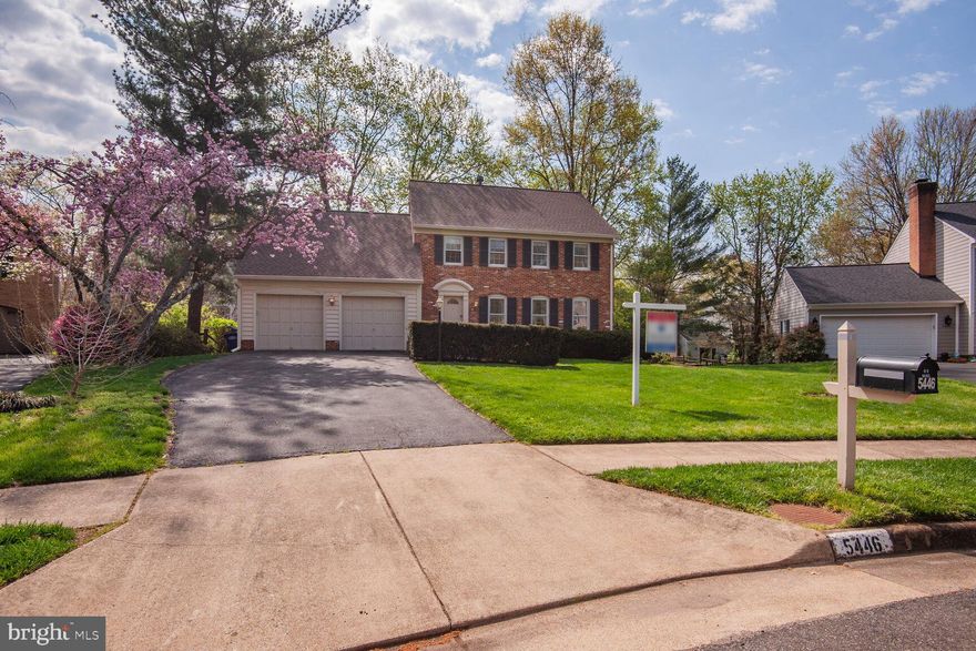 Welcome to 5446 Mount Corcoran Place, a classic brick-front colonial tucked away on a quiet cul-de-sac in the desirable Signal Hill neighborhood of Burke, Virginia. This spacious 4-bedroom, 3.5-bath home offers an excellent opportunity to bring your design vision to life. The main level features a welcoming foyer with wood flooring, a bright and spacious living room, a formal dining room with chair rail and French doors, and an eat-in kitchen with oak cabinetry, wood floors, pantry, and updated refrigerator and dishwasher. Sliding glass doors off the kitchen lead to a relaxing Trex deck overlooking the beautifully landscaped backyard. A cozy family room with a wood-burning fireplace, wood-beam ceiling, and brick surround adds charm and warmth, while the main-level powder room and an attached two-car garage offer everyday convenience. *
Upstairs, you'll find four generously sized bedrooms, including a primary suite with a walk-in closet and en-suite bath featuring ceramic tile flooring and a tiled tub/shower. The upper-level hall bath is also has ceramic tile along with a tub, and the full-size washer and dryer with utility sink make laundry a breeze. The fully finished walk-out basement expands your living space with Pergo-style flooring, a full bath with jetted soaking tub, a wet bar with oak cabinetry, and a versatile bonus room—perfect for a gym, workshop, or private office. Step outside the lower level to a flagstone patio and enjoy the mature landscaping and private yard. * 
Recent updates include new architectural shingle roof in 2023, newer sliding doors, a gas HVAC system with humidifier (2013), and a gas water heater (2018). Ideally located near Lake Braddock High School, with easy access to Rolling Road, Braddock Road, I-495, and the Virginia Railway Express (VRE), this home is close to shopping, parks, and dining. With incredible potential and an unbeatable location, this is your chance to create the home of your dreams.