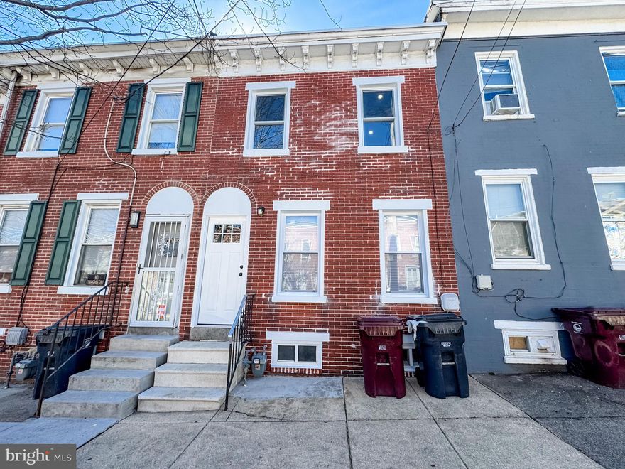 Prepare to be wowed by this fully renovated classic brick Colonial row home in Wilmington! This stunning four-bedroom, 2.5-bathroom home seamlessly blends timeless charm with modern upgrades, including a fully fenced backyard. Step inside to an inviting open-concept living and dining area, where a brand-new electric fireplace serves as the perfect focal point. Grey wood-toned flooring complements the soft grey walls, creating a warm and stylish atmosphere. Just beyond, you’ll find a stunning black-and-white kitchen designed for both style and function. White quartz countertops, brand-new appliances, and sleek white cabinetry offer ample storage, while a chic tiled backsplash ties the space together beautifully. The main floor also includes a well-appointed bedroom and a brand-new half bathroom with all-new fixtures. Upstairs, you’ll find three additional bedrooms, each with plush new carpeting and plenty of natural light. The beautifully renovated hall bathroom features marbled tiles, a rain head shower, a sleek new vanity, and modern fixtures. Completing the second floor is the spacious primary suite, which boasts its own private full bath with a luxurious shower/tub, elegant marbled tile, and all-new fixtures and finishes. Outside, your private fenced-in backyard serves as the perfect retreat—whether you’re unwinding after a long day or hosting a summer barbecue on the patio. With a new HVAC system, roof, plumbing, and electrical updates, this home is truly move-in ready. Conveniently located near major routes, including I-95 and 202, this gem won’t be on the market for long—schedule your tour today!