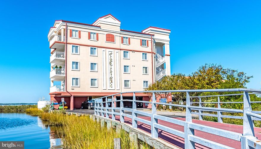 Beautiful south west corner direct bay front 3 bedroom condo located in smaller "boutique" building. The views of Assawoman Bay, wetlands & wildlife are spectacular. Relax on your spacious waterfront wrap around balcony and experience the peace and tranquility. This condo is in excellent condition. Many upgrades and improvements to include, new ceilings, wainscoting, new faced cabinets, new countertops, all new stainless steel Kitchen Aid appliances, new flooring through out, heated bathroom floor, new hot water heater, dual shower system in master bathroom, 2nd bathroom redone, high efficiency heat pump, remote control of locks/shower/HVAC and new washer & dryer.  The property has an open concept floor plan, bay front master suite, gas fireplace, tinted windows, 9-10 ft. ceilings. The building has an outdoor pool, grilling area, covered parking, ground level storage, secure lobby/elevator, and an area to launch your favorite kayak or paddle board. The building is situated in a quiet area, yet is a short walk to the beach, attractions and dining. Truly a very special property.