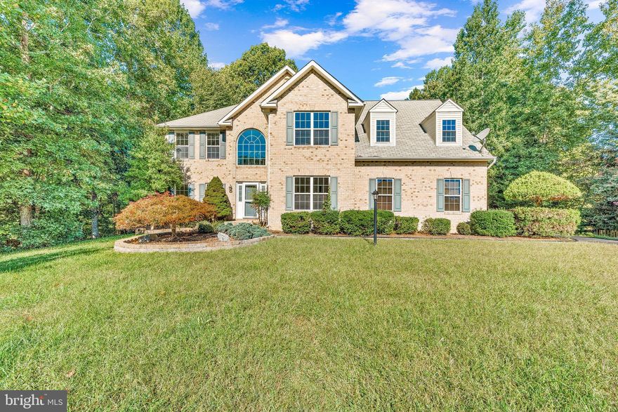 IMMACULATE!!! This beautiful 6 bed, 2.5 bath 2900 SQFT Colonial is well taken care of, inside & out! Immediately upon the drive up, you are greeted by a flat, grassy front yard and beautiful landscaping. Walk up the long sidewalk to enter the home & be greeted with a 2-story foyer with beautiful hardwood floors. The formal living room on the left opens up into a spacious formal dining room, perfect for holiday entertaining with family or friends! Head into the kitchen which boasts hardwood floors, stainless steel appliances, a center island, granite countertops, and an open concept plan that spills into the breakfast nook and large vaulted family room space! The kitchen overlooks the beautiful backyard and allows access to the large back deck! The family room has vaulted ceilings and a gas fireplace, perfect for cozy winter nights and family movie days! The main floor is completed with the homes 6th bedroom that could serve many uses. Upstairs, you do not want to miss the spacious primary suite featuring two large walk-in closets w/ a built-in wall safe and a very spacious primary bath. The primary bath is equipped with a jacuzzi tub, shower, separate water closet and a double vanity w/ granite countertops! The rest of the second level consists of bedrooms 2-5, all with plenty of natural light, and their shared bath with a shower/tub combo! The washer and dryer are located in bedroom #5 that would make a perfect office, craft, or playroom space! Head to the fenced-in backyard to find a built-in sandbox, a built-in firepit, a large patio, a shed for additional storage, and a natural wonderland w/ a creek that is situated beyond the fence but sill on the property! This home is great for a growing household seeking entertainment space and outdoor fun! Don't hesitate as this home is sure to sell quickly!