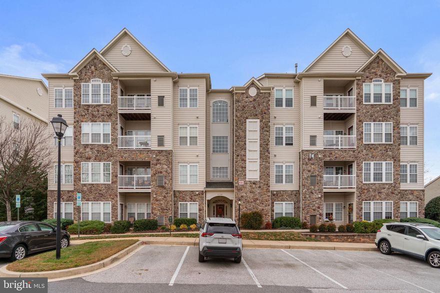 OPEN HOUSE! Come tour this extraordinary unit on Saturday, November 8 from 12 am to 2 pm and see in person all that this vibrant community has to offer. Enjoy the life of ease and plenty you’ve earned in this spacious luxury two-bedroom, two-bath condo in the Waverly Woods 55+ community. Freshly painted in classic whites and featuring brand-new carpet throughout, this home offers an inviting, low-maintenance lifestyle in an elevator building with accessible parking. The kitchen features rich cherry cabinets, granite countertops, stainless steel appliances, gas range, and a breakfast bar open to the breakfast room - perfect for casual dining with balcony access and golf course views. The adjoining living and dining rooms provide generous open space centered around a gas fireplace with stylish recessed mantle. The large primary suite includes an oversized walk-in closet, a sunny sitting room with more golf course views, and an attached bath with dual vanities and a step-in shower. The second bedroom and full hall bath provide ideal flexibility for guests or a home office. A walk-in entry closet, dedicated laundry room, and a private storage room off the balcony add everyday practicality. Residents enjoy this vibrant community’s clubhouse, fitness center, pool, tennis courts, bocce ball, and beautifully maintained grounds. Experience relaxed living and thoughtful design in a home that perfectly fits your next chapter.