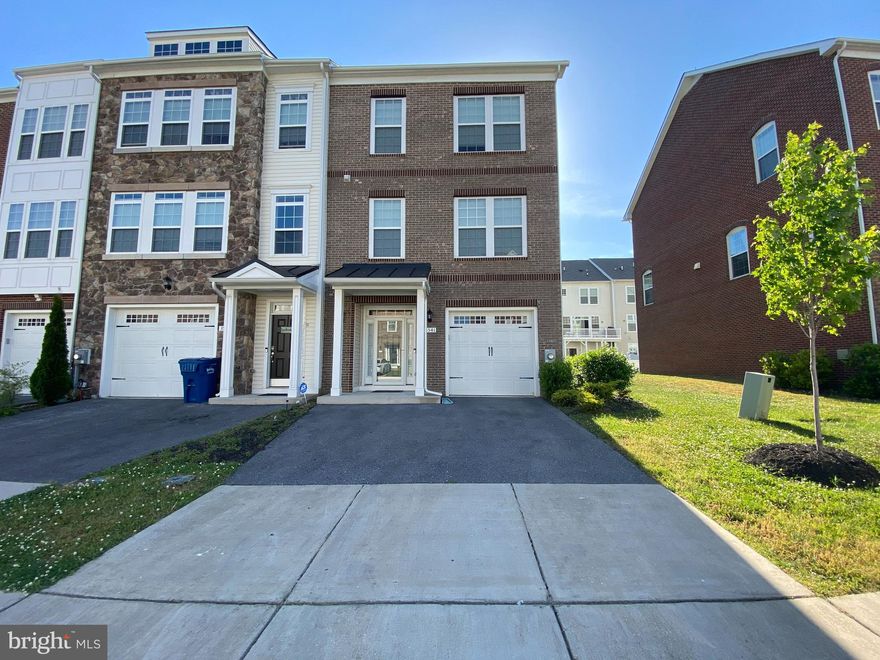 From the moment you pull up to this light brown brick front, garaged end unit townhome, you will feel at home! This cozy home, with easy access to the beltway features a Gourmet kitchen with granite countertops, chocolate 24' cabinets, island w/storage, a lazy susan, a farm sink, pantry, refrig w/icemaker, a gas stove & soft close drawers.  There is a ceiling fan in the living room and all bedrooms upstairs... w/a roommate floorplan! The home has recessed lighting and hardwood floors throughout. This home offers a home warranty.  It's clean and ready for you! Welcome Home!!
