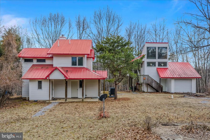 **A Vision Awaiting Its Visionary**
Some stories are written in chapters, and this one is waiting for its next author. Nestled on a generous parcel with Creek frontage, this two-bedroom, one-and-a-half-bath home offers 1,380 square feet of pure potential — a canvas primed and ready for the creative soul willing to pick up where a passionate owner left off. The house itself is unfinished, needing flooring throughout, which means you get to choose every detail from the ground up — literally. Design the interior exactly how you've always imagined, without the hassle of tearing out someone else's choices first. That's not a flaw; that's a gift. There is an additional concrete slab for a future garage. Step outside and the property truly shines. A second building houses a functional garage with a workshop that will make hobbyists and tinkerers weep with joy, plus an unfinished studio apartment upstairs just begging to become a guest suite, rental unit, or creative retreat. A Generac generator and owned propane tank are already in place, keeping you covered when Mother Nature has other plans. Home has recently installed Fiber Optic Internet for your personal or business use if you work from home. Then there's the creek frontage — stunning, serene, and endlessly inspiring. Whether you're casting a line, kayaking, or simply sipping coffee with a view that money rarely buys, this outdoor space delivers something truly special. The subdivision also has a community area on the creek to enjoy time with your family and friends. This area can be used for cookouts, family get togethers or just enjoying nature itself. When it comes to this property, the vision was there. Unfortunately, the time was not. Perhaps yours is now. Bring your vision and finish what he had started. Schedule your showing and come write the next chapter.  ( HOUSE IS NOT IN THE FLOOD PLAIN)
INSIDE HOME PHOTOS YET TO COME