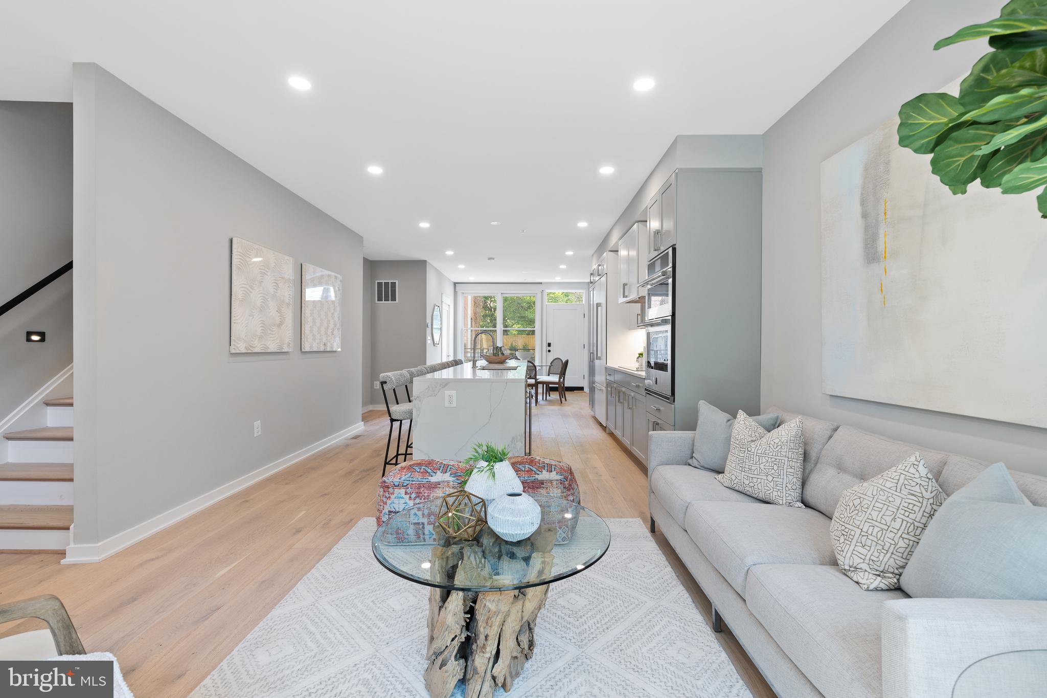 Just Reduced $100,000 in the last few weeks.
Welcome Home to Ebenezer Row, located at 406 D Street, this exquisite new construction spans an impressive 2,500 square feet across four levels, providing a perfect blend of privacy and spaciousness. The home features a modern layout with 5 bedrooms and 5.5 bathrooms, each thoughtfully designed with an en-suite bathrooms in all bedrooms, making it ideal for families or for hosting guests.
This property offers dual-car parking—a notable convenience in its vibrant neighborhood. The architectural design is cutting-edge, equipped with state-of-the-art amenities and finishes, setting a new standard for luxurious urban living.
Inside, the residence showcases top-tier Jenn Air appliances, including an induction cooktop that complements the culinary experience. The kitchen is a work of art, featuring bespoke J Suss cabinetry and a striking waterfall island at the heart of an open-plan layout, seamlessly integrating living and dining areas—perfect for both entertaining and relaxation.
Comfort meets style in the spacious bedrooms, each fitted with elfa closet systems for maximum organization. The primary bathroom offers a tranquil retreat with a frameless shower and dual vanity, while the guest suites boast large tubs with mosaic tile finishes, providing a spa-like atmosphere.
The lower level enhances living space with a large family room, a fully equipped wet bar, an additional laundry room, and a generously-sized bedroom with an en-suite bathroom.
Every detail in this home is meticulously crafted, from the 9-foot ceilings that invite natural light, to the wide plank oak flooring with a matte finish, adding a touch of understated elegance.
This property is not just a home, but a lifestyle choice, offering an unparalleled living experience in the heart of Washington, D.C., just moments away from Barracks Row, Eastern Market, and the Ballpark District. This is where modern amenities meet luxurious comfort, creating the ultimate urban sanctuary.