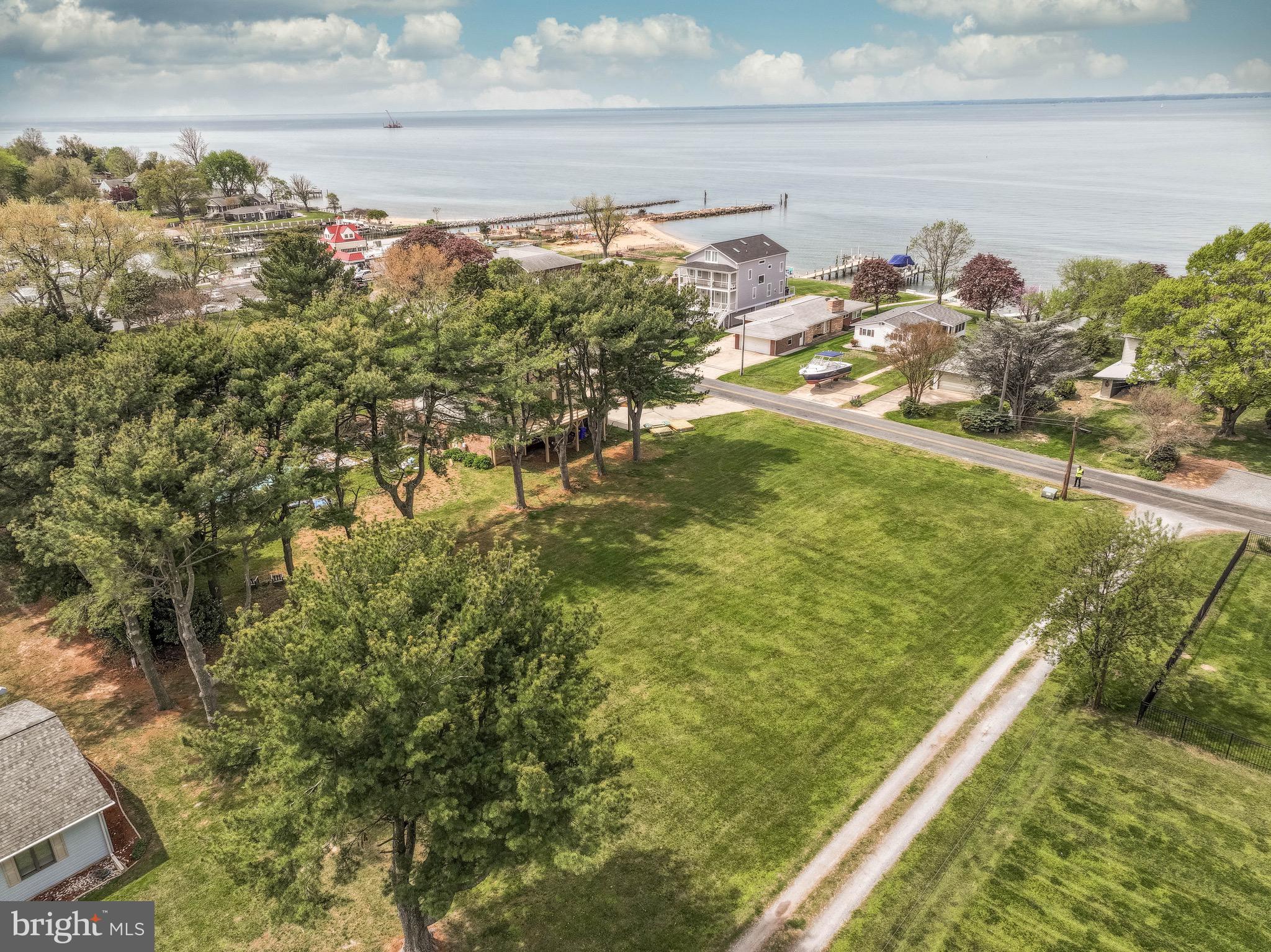 Looking for a nice cleared flat lot that happens to be sitting in a Chesapeake Bay waterfront community-Then come check this one out..
Quick walk to the community beach, marina, waterfront bar & grill, and local shopping & Dining.
Public sewer with a convenient commute to the Bay Bridge.
Bring your beautiful new home plans and come see for your self.
ATTENTION…. WHEN CLICKING ON THE TAX MAP AT TOP PAGE OF LISTING, IT APPEARS THE LOT IS SHOWING IN THE WRONG LOCATION. THIS LOT IS ACTUALLY LOCATED AT KENTMORR RD & REYNOLDS AVE JUST CLICK ON THAT LOT TO FIND CORRECT LOCATION.
RIGHT BEHIND WATERFRONT HOMES.