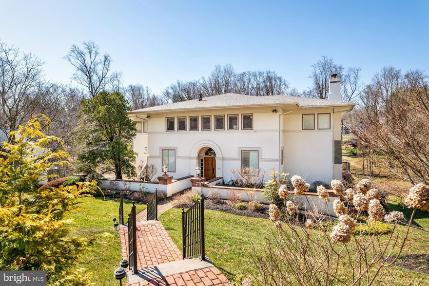 This exceptional 5-bedroom, 3 full bath, and 2 half bath home is nestled at the end of a desirable cul-de-sac, offering both privacy and a serene setting. Thoughtfully designed for comfort and functionality, it boasts a gunite pool, multiple decks, and spacious living areas that make it ideal for everyday living and effortless entertaining.

A dramatic two-story foyer welcomes you into the main level, where a modern kitchen is outfitted with high-end appliances including a gas Thermador stove, double ovens, a Sub-Zero refrigerator, and a Bosch dishwasher. The adjacent breakfast area opens directly to the deck, creating a seamless indoor-outdoor connection. The dining room also features deck access—perfect for al fresco meals or entertaining guests. A living room, family room, dedicated office, and convenient first-floor laundry room round out this well-appointed level.

Upstairs, the primary suite serves as a luxurious retreat with two walk-in closets, built-in storage, and a private deck that overlooks the lush rear grounds. The updated en-suite bathroom includes a soaking tub and a separate stand-up shower. The second and third bedrooms share a Jack and Jill bathroom, while the fourth and fifth bedrooms—located in the rear of the home—share a hall bath and have access to a shared balcony with backyard views. Notably, this rear bedroom area offers the flexibility to convert into a two-bedroom suite with a full bath, perfect for guests or extended family living.

The expansive rear deck offers sweeping views of the surrounding woodlands, providing an idyllic backdrop for relaxation or entertaining.

The finished lower level adds versatile living space, featuring a cozy fireplace, a bar area with sink and fridge, a small dining space ideal for summer snacks, and a half bath. The walk-out design allows for easy access to the pool and garage, enhancing the home’s functionality and entertainment potential.

Additional highlights include gas heat, central air conditioning, and a portable emergency gas-powered generator with direct circuit access. Set in a highly sought-after location at the end of a quiet cul-de-sac, this home delivers peaceful living with modern amenities and exceptional outdoor living.