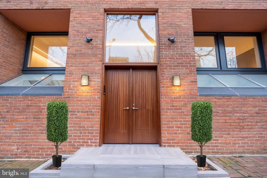 Rare opportunity to own a spectacular and completely brand-new modern home in Society Hill.  Situated at 110 Delancey Street, the home was originally built in the 1960s, replacing two Federal townhouses. The lot is 72 feet deep overall, with the house occupying approximately half of that. The brilliant top-to-bottom renovation of this dwelling was the capstone project of Cecil Baker, who has been called “an architect’s architect.”  He is known for “a mix of calming symmetry and restless asymmetry,” according to Architect Magazine.  Entering the front door, you’re met with a dramatic staircase to the first floor.  At the top of the stair on the left is an architecturally hidden powder room. Turn left to enter the large open kitchen, which features a massive plate glass window overlooking Delancey Street.  With long runs of counters, a Sub-Zero refrigerator, a Wolf double oven with cobalt blue ceramic interiors and a Wolf microwave under-mounted in the middle island, and a five burner gas stove, this fabulous kitchen also includes an island, wine cooler, breakfast bar, and sleek plentiful cupboards, including one with a lazy susan inside.  Other amenities include a step-on trash compacter, Bosch dishwasher, ice maker, and wine cooler.  The handle-less cabinetry by Poggenpohl simply pulls open.  The Miele coffee maker is built in and speaks three languages.  Not only is this kitchen elegant and streamlined, but also fabulously functional. Adjacent to the kitchen is a lavish, spacious great room/den.  This features a massive piece of beautiful custom cabinetry housing a flat screen TV over a gas fireplace.  At the south end of the living room is a huge window wall overlooking the private back yard. On the right of the entry stairs is a sleek dining room, also with a vast window overlooking Delancey.  This space also features an abundance of built-in custom cabinetry for organizing and storage. Just behind the dining room is a spacious living room, also overlooking the back yard area.  A perfect spot for entertaining, it features an elegant fireplace and sophisticated lighting.The back patio boasts luxurious brand-new assets that are unique in historic Society Hill:  an in-ground waterfall swimming pool with resistant waves, hot tub, fire pit, retractable awning, an outdoor kitchen with grill, sink and refrigerator, and a dining area.  Even the drains are carefully designed and artful. European White Oak flooring, concrete walls, shades of grey stone and glass half-walls, are repeating materials and hallmarks throughout the home.  A stunning floating staircase,leads to the second floor. Here, the primary suite has a spa-like, relaxing ambiance, full of light and overlooking the pool.  The suite features huge double walk-in closets, full of custom cabinetry with shelving, drawers, hanging rods and a Dressing room/ Office. Its bathroom has double sinks, a frosted glass shower with rainhead shower, medicine cabinets, a skylight, and a private commode. On the third floor are two spacious bedrooms, each adjoining a bath in the middle.  Light floods in from two large windows in each bedroom, and from smaller windows in the bath.  The bath features a Robern medicine cabinet with torch lights, double sinks and Caesar-stone countertops. A multi-use room in the lower level runs the length of the house, from front to back.   To reach the back yard, a basement door leads to the curved staircase inside a charming brick wall. The fourth bedroom is in the Lower level, with its own bathroom, closet and window.  The bath features a river rock-like shower floor, and an angled flow from the sink.  This floor also houses a Laundry, Cedar Closet, Sonos ,security system and mechanicals. This home is a must see!