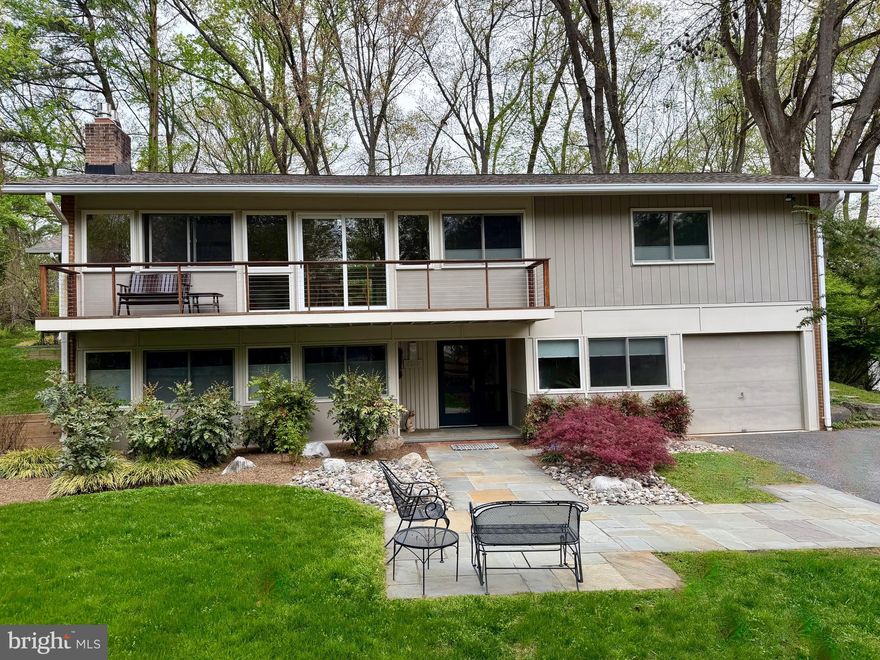 This beautiful home in Carderock Springs is an original Bennet Overlook Model that has been expanded. It includes a custom kitchen with granite countertops, custom cabinetry, and more. The back has been bumped out for a vaulted ceiling great room with a full back windowed wall that look out onto a flagstone patio and a deep, private landscaped back yard.  A generous screened-in porch addition with outdoor grilling deck is one of the most favorite rooms of the house. The light-filled dining room/living room combination that opens out to a long balcony on the front of the house. This 4 Bedroom 3 Bath Home includes an entry-level bedroom and bath, a large but cozy family room with gas-insert fireplace, laundry, and lots of storage. The second level has the primary bedroom and ensuite bath, with two more bedrooms and a bathroom with a skylight.