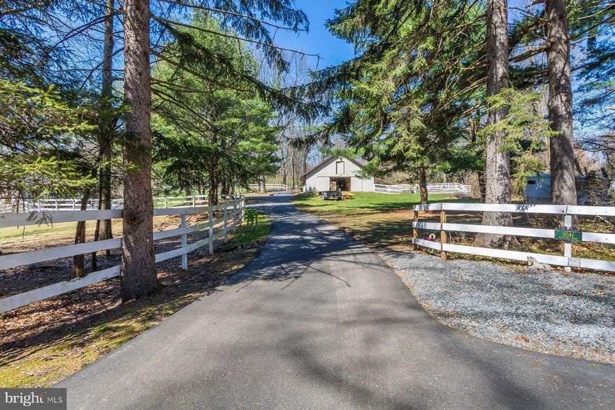 Morning Glory Farm is a lovely, secluded 11+acre equestrian property located in Buckingham Township perfect for the horse enthusiast.  The property includes a 5 bedroom Colonial home and a 10 stall barn with acres of fenced pastures and riding ring. The home offers a formal living room with fireplace and a formal dining room.  The large kitchen features an oversized center island with 6 burner gas range and copper hood, lots of counter space, a pantry and a beautiful, bright breakfast area.  Doors open out to a big deck which is partially covered making it the perfect spot for seasonal outdoor dining and enjoying the views of the inground pool and many fields and pastures.  The main floor also includes a beautiful family room with beamed ceilings, fireplace, a large bay window and additional doors opening out to the deck area.  There is also a large, bright in-home office with a wall of windows offering beautiful views of the property.  There is a powder room and a mud room on this level.    
The second floor offers a master suite with 2 walk- in closets and a master bath with double sinks, jacuzzi tub and separate shower.  There are an additional 4 bedrooms and 2 full baths as well as several walk-in closets and a back staircase.
The lower level of the home is fully finished and offers a private entrance.  There is a living room, kitchenette, 2 bedrooms and a full bath plus an outdoor patio making this the perfect in-law suite or au pair suite. Other property amenities include the 10 stall barn with tack room, fenced pastures, a riding ring, an in ground heated pool with storage shed for pool equipment and a 3 car attached garage.This beautiful private home is perfectly located between Doylestown and New Hope.