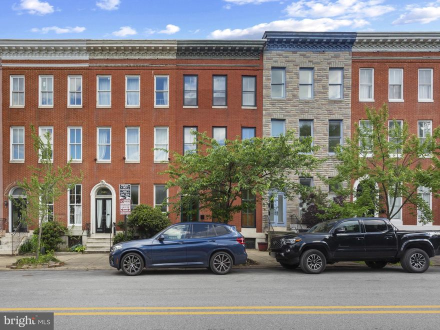 Overlooking the picturesque green of Union Square, this beautifully restored 4-bedroom, 2.5-bath home offers a rare blend of historic elegance, thoughtful updates, and everyday livability.
A true period-correct restoration, the home showcases its original craftsmanship at every turn—from stately doors and intricate plaster cornices to rich wood moldings, gleaming floors, and classic mantels. Fireplaces add to the historic ambiance, while large windows frame charming views of the park just beyond your doorstep.
The home has been carefully restored rather than renovated, preserving its authenticity while incorporating key modern updates. The kitchen has been recently refreshed, offering a functional and inviting space for daily living, while the bathrooms are standout features—beautifully designed with a mix of modern convenience and timeless style.
With four spacious bedrooms and 2.5 baths, there’s room to live, work, and host with ease. Outdoor spaces elevate the lifestyle even further, including a private rear yard, a deck perfect for relaxing or entertaining, and the coveted bonus of dedicated parking.
Comfort is seamless thanks to central air conditioning and efficient gas heat.
All of this, set against the backdrop of one of Baltimore’s most beloved parks, creates a home that is as distinctive as it is livable.