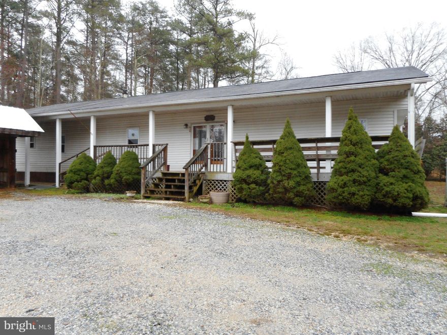 Mobile home on 1 acre of land.  3 car carport.  Nice private location.