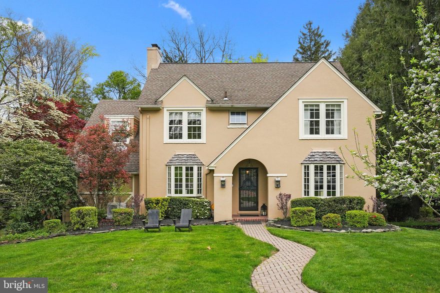 Nestled in the prestigious neighborhood of Edgehill Gardens, this 1920’s masterpiece exudes grandeur and charm at every turn. As you enter the welcoming center hall, you're greeted by a gracious wood staircase and beautiful hardwood floors that flow throughout the home. The spacious living room is adorned with a brick wood-burning fireplace, a large bay window that floods the room with natural light, and elegant French doors leading to a large formal dining room, which offers a serene view of the lush backyard through a wall of windows, two built-in china closets and wall sconces. Adjacent to the living room is a handsome sunroom/den showcasing architectural details highlighted by two arched windows, a stained-glass window and a unique detailed door leading to the lower level. This room also has a glass door leading to the formal dining room.
The kitchen is a chef's dream, featuring a large island with a butcher block top, seating for four, and top-of-the-line stainless steel appliances, including a Wolf six-burner gas range. A sunny breakfast area with casement windows opens onto the rear deck, perfect for al fresco dining. The casual dining room, highlighted by crown molding, a corner built-in niche, a large bay window and French doors, is the perfect spot for smaller gatherings, or a home office. Tucked away just off the kitchen is a back hallway with a powder room, a door to the back staircase to the second level and a door to the elevated rear deck. The second level houses the primary wing, complete with a spacious walk-in closet and an updated bathroom featuring a white vanity, custom wood detail and a luxurious custom-tiled frameless glass shower. Two additional bedrooms, a large hall bath with a double sink vanity and a convenient hall laundry room complete this level. Ascend to the third level to discover two more bedrooms, a bonus area, and a bathroom, which is primed and plumbed for a shower or tub customization. The lower walk-out level with Pella windows offers versatility, with a finished area currently utilized as a gym, accompanied by a shower and a powder room, multiple closets and a tool room with sink. Access to the heated garage ensures convenience year-round. Outside, a private elevated deck provides the perfect spot to admire the lush backyard, which is complete with an outdoor kitchen/hand-stacked firepit area and a driveway tucked discreetly to the side. This distinguished home in Edgehill Gardens seamlessly blends timeless elegance with modern amenities, offering luxurious living in a coveted neighborhood setting. 904 Overton offers Pennsbury schools, close proximity to the historic canal path, major roadways, shopping and easy access to trains to Philadelphia, Princeton, and New York City.