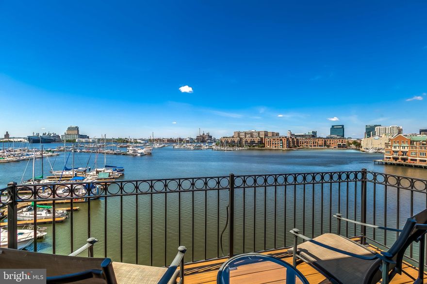 Magnificent waterfront home in Canton. North Shore's finest residence offering sweeping views of the harbor, Fells Point, Canton marina and beyond.  Four floors of unprecedented luxury.  End of group townhouse condominium with windows on three sides.  Enormous light filled rooms complete with custom millwork, high-end appliances and fixtures and a remarkably livable floorplan.  The master suite encompasses the entire fourth floor of this 4000+ sq ft residence and incorporates a spacious bath, large walk-in closet, vaulted ceilings, fireplace and waterfront balcony. The two car garage is complemented by two additional parking spaces next to the home and additional space behind the garage accommodating a total of five vehicles.  Incredibly convenient location in the heart of Canton and minutes away from Fells Point and Johns Hopkins Hospital.  This is downtown living at its finest.