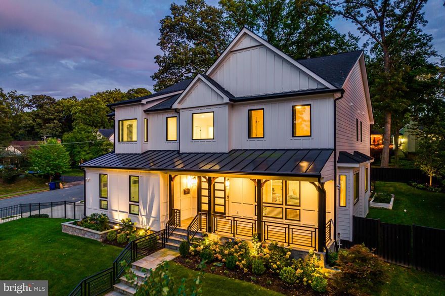 Stunning 6 bedroom, 5.5 bathroom transitional style home now available in Golf Club Manor in North Arlington! This custom 7000 sqft home sits on a beautiful, fully fenced corner lot on a nearly third of an acre with well-manicured landscaping and hardscaping. A stunning two story grand foyer welcomes you onto the main floor which contains a living room, coffered dining room, family room with gas fireplace, main level bedroom/office with en suite bath and walk-in closet, and gourmet kitchen with quartz countertops, stainless steel thermador appliances, 6 burner gas stove with griddle and double oven. A powder room, mudroom and access to the 2-car garage complete the floor. The rear facing quarter turn staircase takes you to the upper level where there are an additional four bedrooms and a sitting area. Two of the bedrooms share a Jack and Jill bath, while the third bedroom is an en suite. The expansive primary suite features vaulted ceiling with wooden beams, a designer walk-in closet with built in  custom shelving, access to the upper level laundry room, and a luxurious en suite bath with heated towel rack, dual sink vanity, walk-in rain shower, water closet and soaking tub. The lower level was designed for entertaining with a wet bar, recreation room, fitness room and sixth bedroom with en suite bath and walk-in closet.  Built in 2022 by Jaz Construction, every aspect of this home was carefully curated to be high end and luxurious as well as functional. Some premium features include 10’ ceilings on the main floor, 9’ ceilings on the upper level, hardwood floors throughout, soft-close cabinetry and Pella windows. A commuter’s dream, this home is conveniently located a mile from Chain Bridge and the DC Line, and two miles from grocery stores, restaurants, coffee shops and more! Don’t miss this opportunity to own this fabulous home! Welcome home to 4200 40th St N!