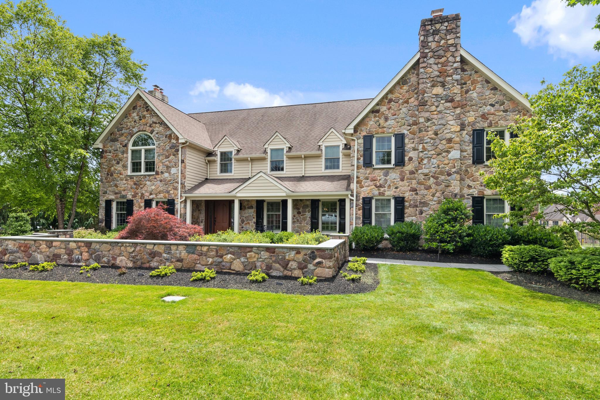 Absolutely stunning home on .94 acres. Beautifully renovated over the last 10 years, this gorgeous home has all the character you would want yet is brimming with many custom modern touches and amenities! You can easily tell that this home was renovated with care and a discerning eye. First floor features an unbelievable new kitchen with eating area, custom Village handcrafted cabinets, Quartzite countertops, wood flooring, separate full-sized Sub Zero refrigerator and freezer, Miele double wall ovens and warming drawer, additional oven with gas cooktop and extremely oversized eat-at island that seats at least 6 and has an abundance of storage. Hands-free faucets. Built-in Butlers pantry with Elkay nickel sink, built in Coffee center and two built in pantry closets and a Miele wine refrigerator and a beverage refrigerator. Mudroom has a wall of floor-to-ceiling storage and a hall closet that leads to the garage area and side entrance. Spacious, sun lit family room offers Cathedral ceilings, walled stone fireplace & skylights and a french door to the patio. The dining area is very comfortable and easily accommodates a table for at least a dozen. The living room has wood flooring and a second gas fireplace. Also on the first floor is the laundry, and a gorgeous home office with custom built in shelving and custom wood high ceilings and exits to the patio and heated pool and three hole putting green. The second floor has all wood flooring and includes a new renovated master bedroom with Tray ceiling which they added and his & her custom closets and third fireplace. A totally remodeled master bath with quartz counters, oversized standing shower with new skylight...new marble flooring, heated floor and more. 4 other generously sized bedrooms, two which share a Jack & Jill bathroom. The other two share a fully renovated bath with separate closet and elegant shower! Outside you will find wonderful space for the whole family to enjoy. A two teared flagstone patio and an outdoor fireplace in the rear of the home is wonderful for lounging and entertaining, The whole yard and home are quite private with mature trees and lovely landscaping plus the driveway has been enlarged to accommodate at least 6 cars. Other amenities include: All new windows & doors; camera monitor system; new outdoor shutters; irrigation system; landscaping lighting; new metal fencing and much more. Excellent schools - Wissahickon, close to new Springhouse shopping center and train is 1/2 mile away. You will want to see this one for sure!
