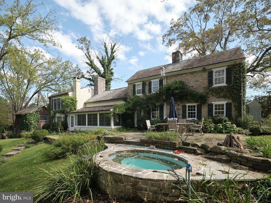 Experience Carversville in its most compelling setting with this 4 BR stone house overlooking Paunacussing Creek. With its working, walk-in stone fireplace, beamed ceilings, wide-plank floors, this 1785 home has preserved many original features, while still appealing to the modern lifestyle. Kitchen was renovated with distressed cabinetry and a stone counter that fits right in with the old house ambiance. A bank of windows overlooks the expansive gardens and creek, with specimen plants, a terraced lawn and flagstone patio. A new woodstove heats the sunroom, bringing the outside in during all seasons. Renovated bathrooms feature Carrera marble and glass shower doors; a steam shower and radiant floor heating turn the first floor bath into a spa. A main floor bedroom with exposed stone walls and entry door could easily serve as an office. It passes through what we call the Tavern Room, possibly the earliest section of the house with a fireplace and pie stairs to the second floor. The 2.97 acres encompass a wide range of perennials and flowering shrubs, and the property extends along the opposite side of the creek, crossed by an arched walking bridge. Walk through an iron gate to the lovely in-ground pool and cabana, complete with an outdoor shower. A barn with electricity and second floor serves as a 2-car oversized garage. This property has been featured on the New Hope Historical Society's annual garden tour. Check out the extensive list of improvements made by the current owner.