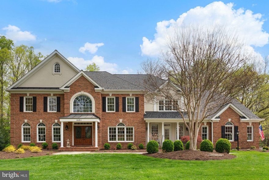 Immaculate home in the highly sought after Ashgrove community close to the Greater Tyson's Green, on a private cul-de-sac and an 0.85-acre lot! This open plan designed home offers 5 bedrooms, 4 full bathrooms, 2 half bathrooms, and 7,251 finished square feet across three spacious levels. This home features tons of added upgrades throughout with transom windows, detailed molding, chair railings, crown molding, recessed lighting, and hardwood flooring. Charming front porch welcomes you inside to a two-story foyer, living room, formal dining room, and a grand family room featuring a two-story ceiling, built-ins and a marble fireplace. Chef’s gourmet kitchen with granite countertops, stainless steel appliances, plenty of cabinetry, double ovens, four-burner cooktop with griddle, large center island with bar-seating option. Breakfast room includes a butler’s pantry that’s perfect for casual dining with easy access to three seasons screened-in porch. Second porch entrance to home's "center hub" that leads to laundry room, mudroom, half bath, and second staircase. Upper level owner’s suite includes sitting area, two walk-in closets, and a luxurious ensuite bathroom with dual separate vanities, soaking tub, frameless walk-in shower with bench seating. Three additional bedrooms and two bathrooms on the upper level. Walk-out lower level is perfect for entertaining or relaxing, with a recreation room, an exercise room, a private fifth bedroom suite, and kitchenette. Perfect for in-laws/au-pair with its versatile space that offers endless possibilities. Enjoy outdoor living on the back deck, patio under deck providing shade, well maintained backyard, and mature trees great for privacy. Three car side-loading garage and the only concrete driveway  in the neighborhood suited for multiple cars. All of this in a prime Vienna location, close to the W&OD Trail, local parks, downtown shops, restaurants, and the Metro. Westbriar /Kilmer/Marshall Pyramid.